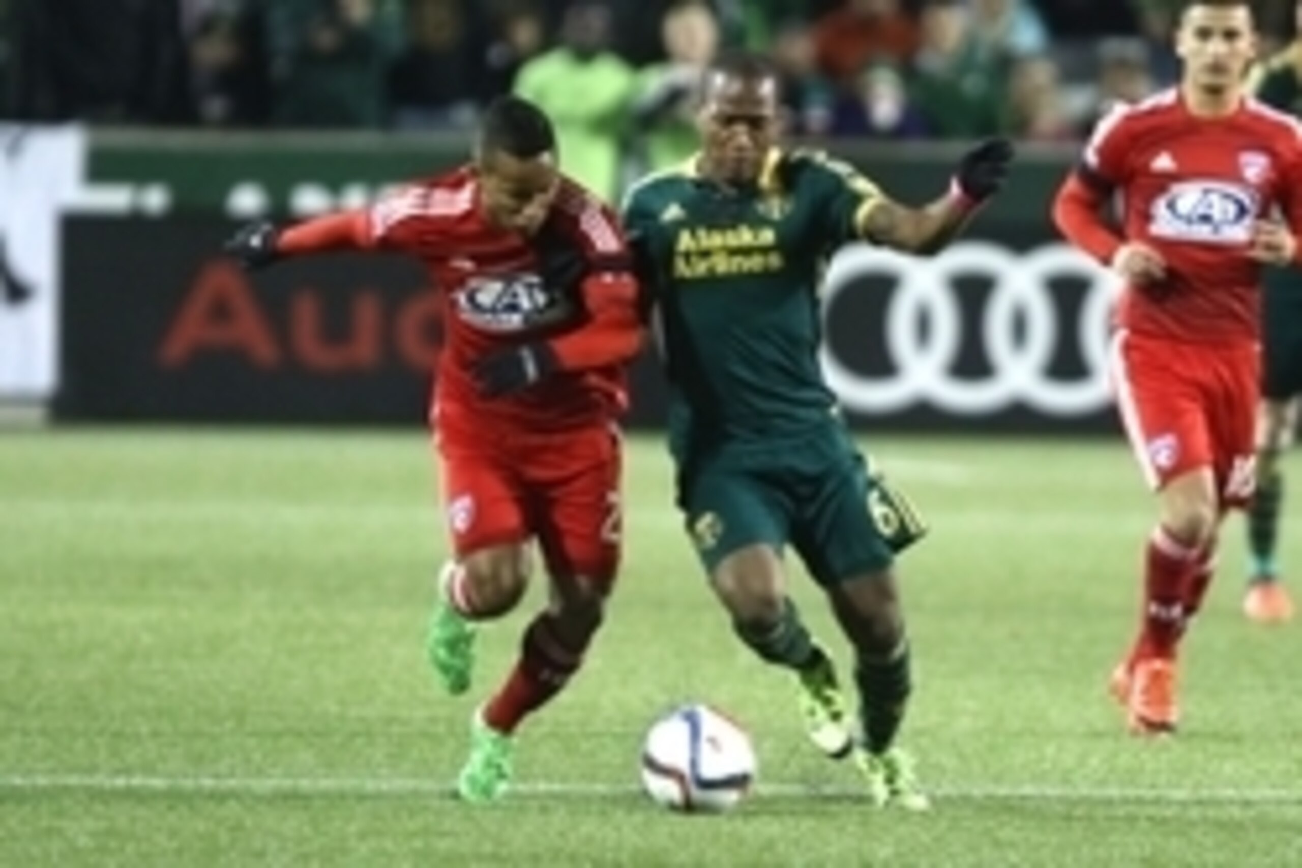 Nov 22, 2015; Portland, OR, USA; FC Dallas midfielder Michael Barrios (21) and Portland Timbers forward/midfielder Darlington Nagbe (6) battle for the ball in the first half of leg one of the Western Conference championship at Providence Park. Mandatory C