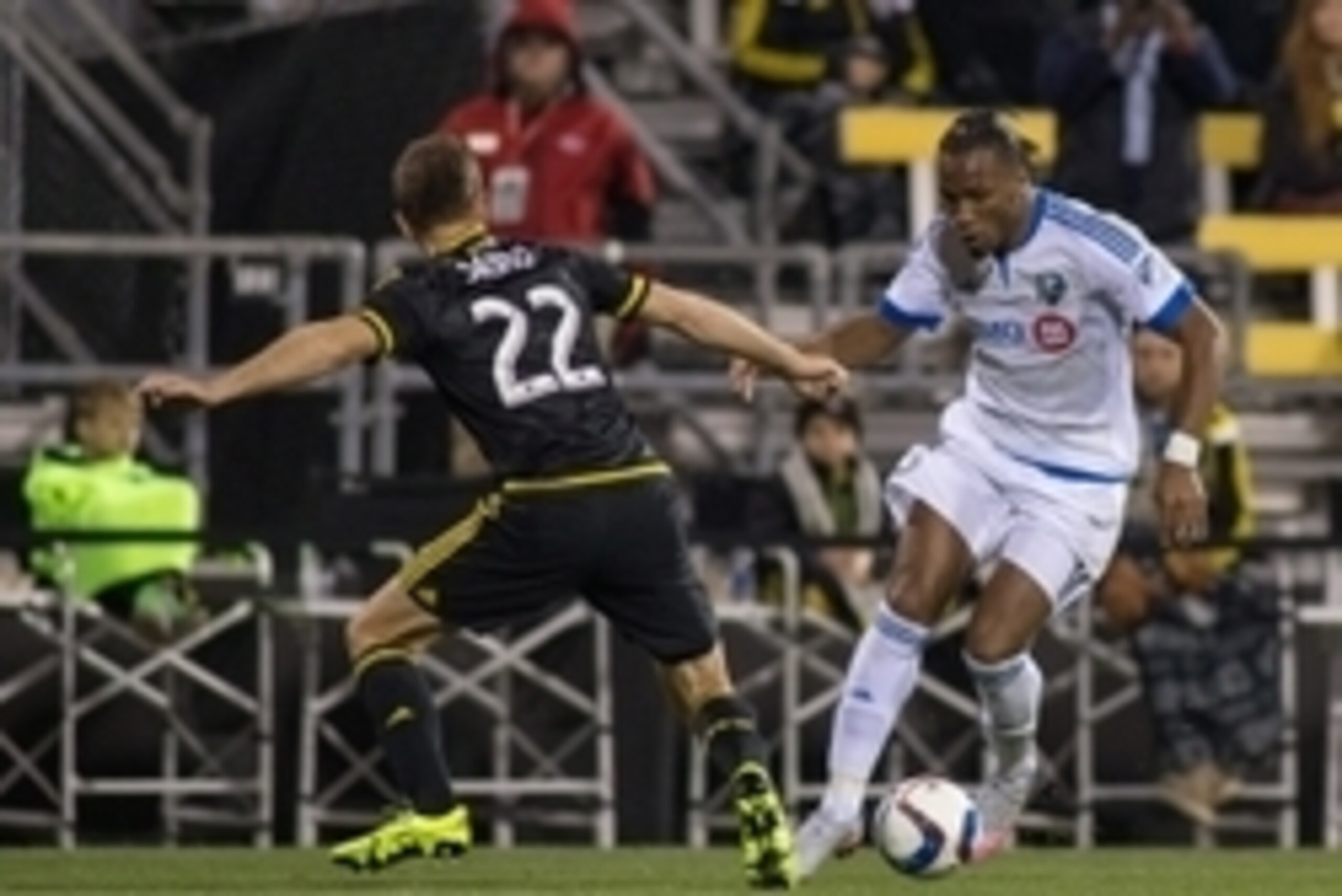 Nov 8, 2015; Columbus, OH, USA; Montreal Impact forward Didier Drogba (11) dribbles the ball while Columbus Crew SC defender Gaston Sauro (22) defends during the extra time in the game at MAPFRE Stadium. Columbus beat Montreal in extra time 4-3 on aggrega