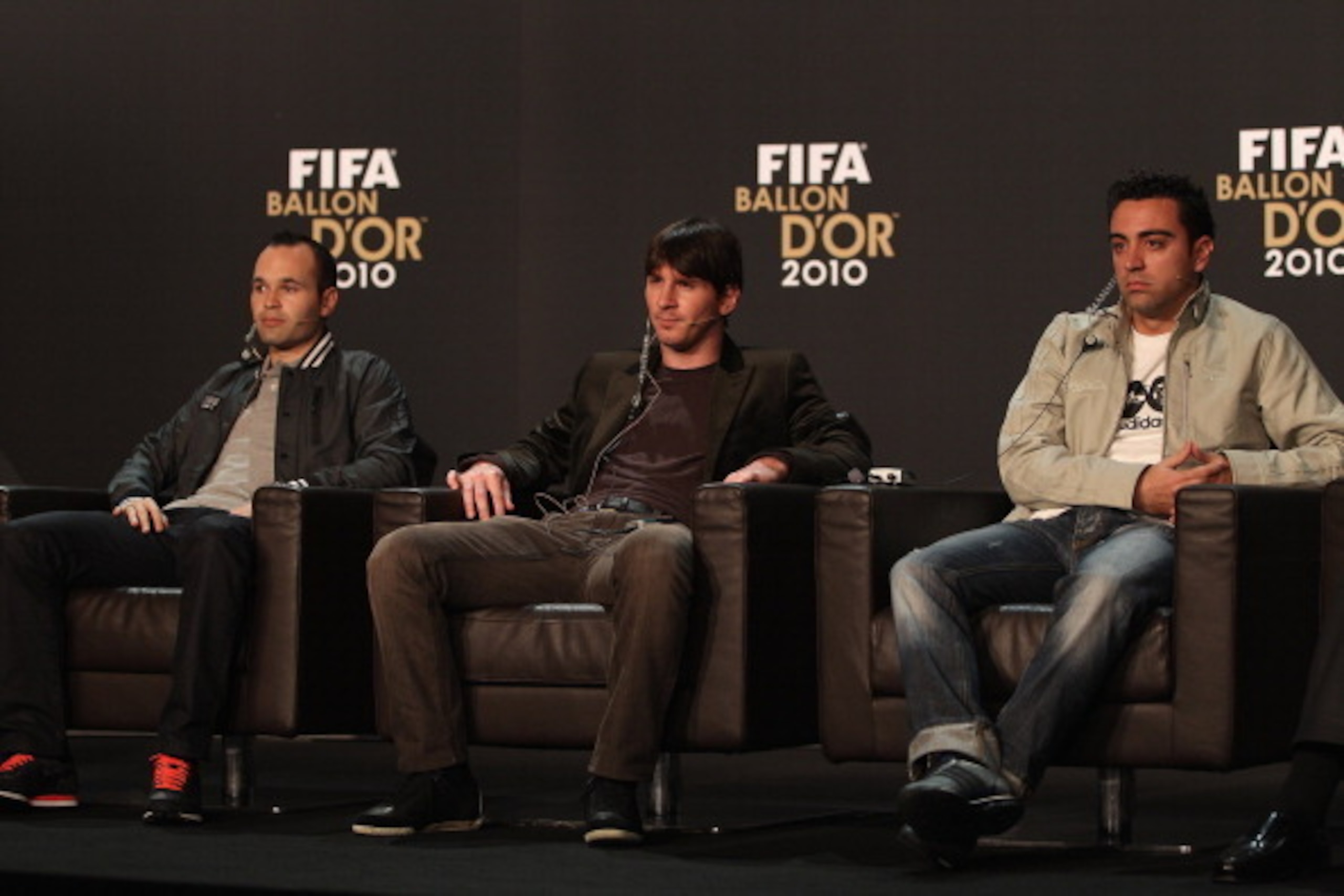 ZURICH, SWITZERLAND - JANUARY 10:  Lionel Messi (c) of Argentina alongside Xavi (r) and Andres Iniesta (l) of Spain during a press conference ahead of the FIFA Ballon d'or Gala at the Zurich Kongresshaus on January 10, 2011 in Zurich, Switzerland.  (Photo
