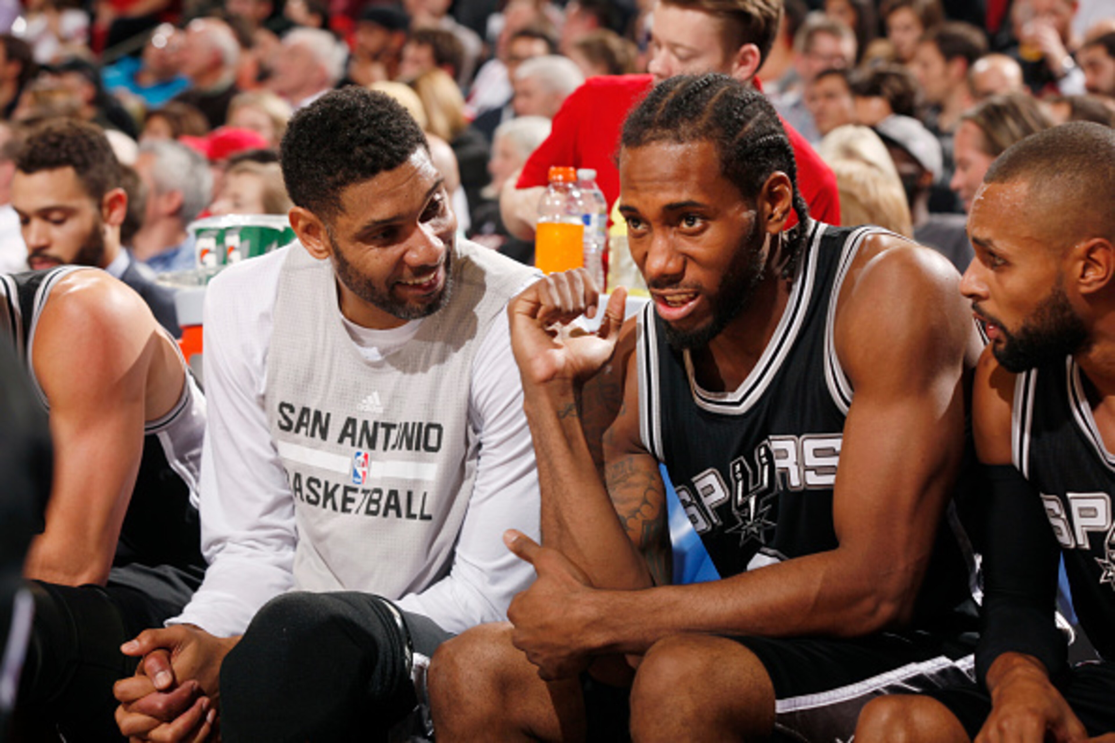 PORTLAND, OR - NOVEMBER 11: Tim Duncan #21 of the San Antonio Spurs and Kawhi Leonard #2 of the San Antonio Spurs during the game on November 11, 2015 at Moda Center in Portland, Oregon. NOTE TO USER: User expressly acknowledges and agrees that, by downlo