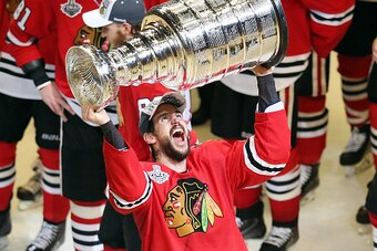 CHICAGO, IL - JUNE 15: Antoine Vermette #80 of the Chicago Blackhawks celebrates by hoisting the Stanley Cup after defeating the Tampa Bay Lightning  by a score of 2-0 in Game Six to win the 2015 NHL Stanley Cup Final at the United Center  on June 15, 201
