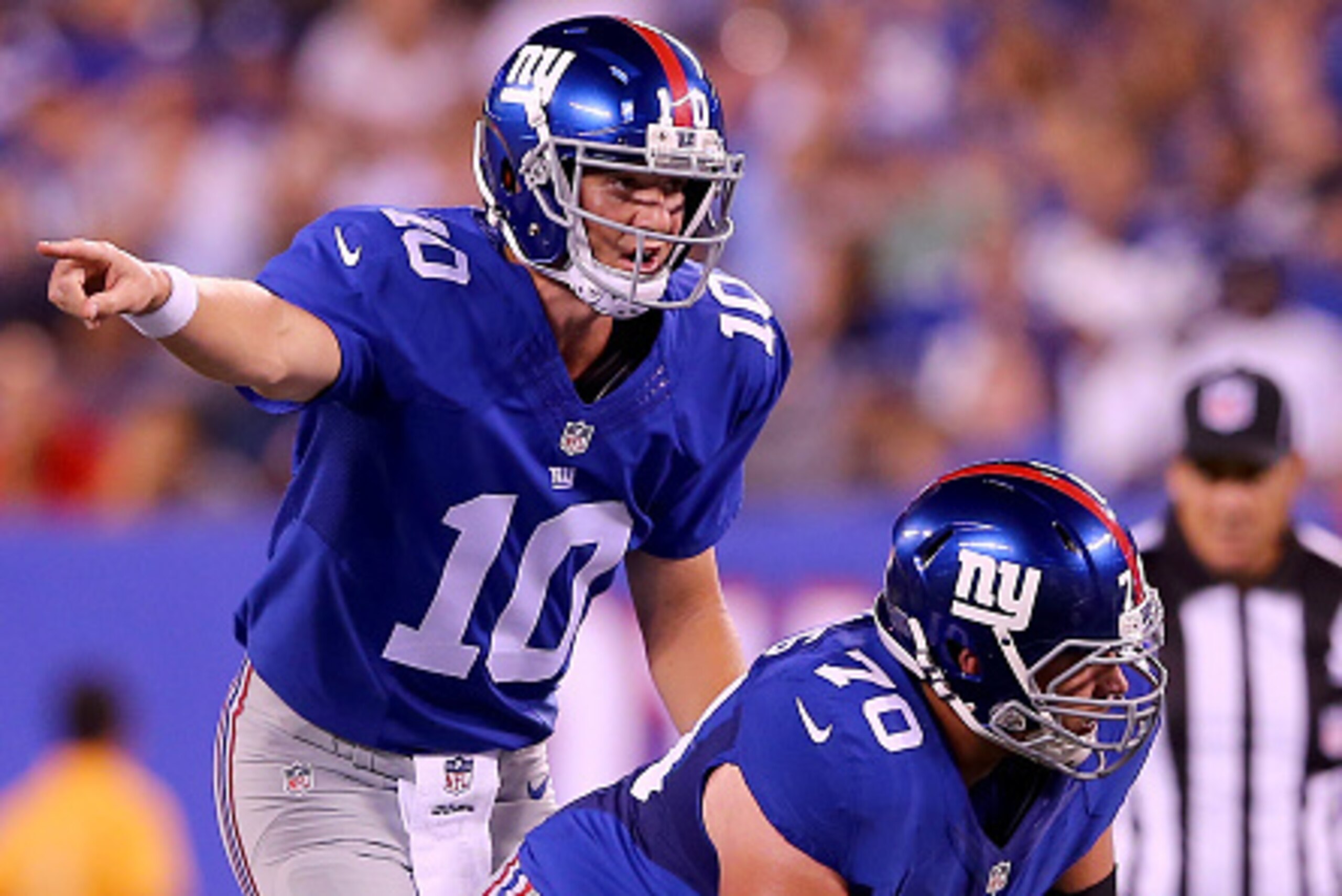EAST RUTHERFORD, NJ - AUGUST 22:   Eli Manning #10 of the New York Giants calls out the play as  Weston Richburg #70 prepares to make the snap in the first quarter against the Jacksonville Jaguars during preseason action at MetLife Stadium on August 22, 2