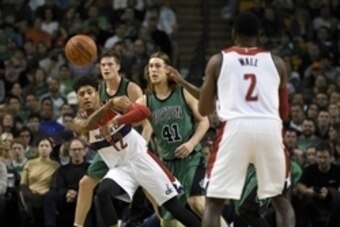 Nov 27, 2015; Boston, MA, USA; Washington Wizards forward Kelly Oubre Jr. (12) passes the ball to guard John Wall (2) during the second half against the Boston Celtics at TD Garden. Mandatory Credit: Bob DeChiara-USA TODAY Sports