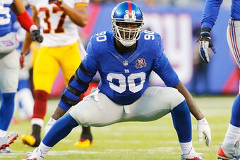 EAST RUTHERFORD, NJ - DECEMBER 14:  (NEW YORK DAILIES OUT)    Jason Pierre-Paul #90 of the New York Giants in action against the Washington Redskins on December 14, 2014 at MetLife Stadium in East Rutherford, New Jersey. The Giants defeated the Redskins 2