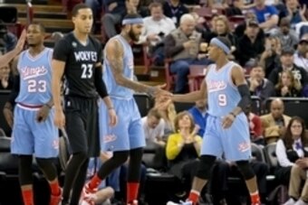 Nov 27, 2015; Sacramento, CA, USA; Sacramento Kings guard Rajon Rondo (9) high fives center Willie Cauley-Stein (00) after scoring against the Minnesota Timberwolves during the first quarter at Sleep Train Arena. Mandatory Credit: Kelley L Cox-USA TODAY S