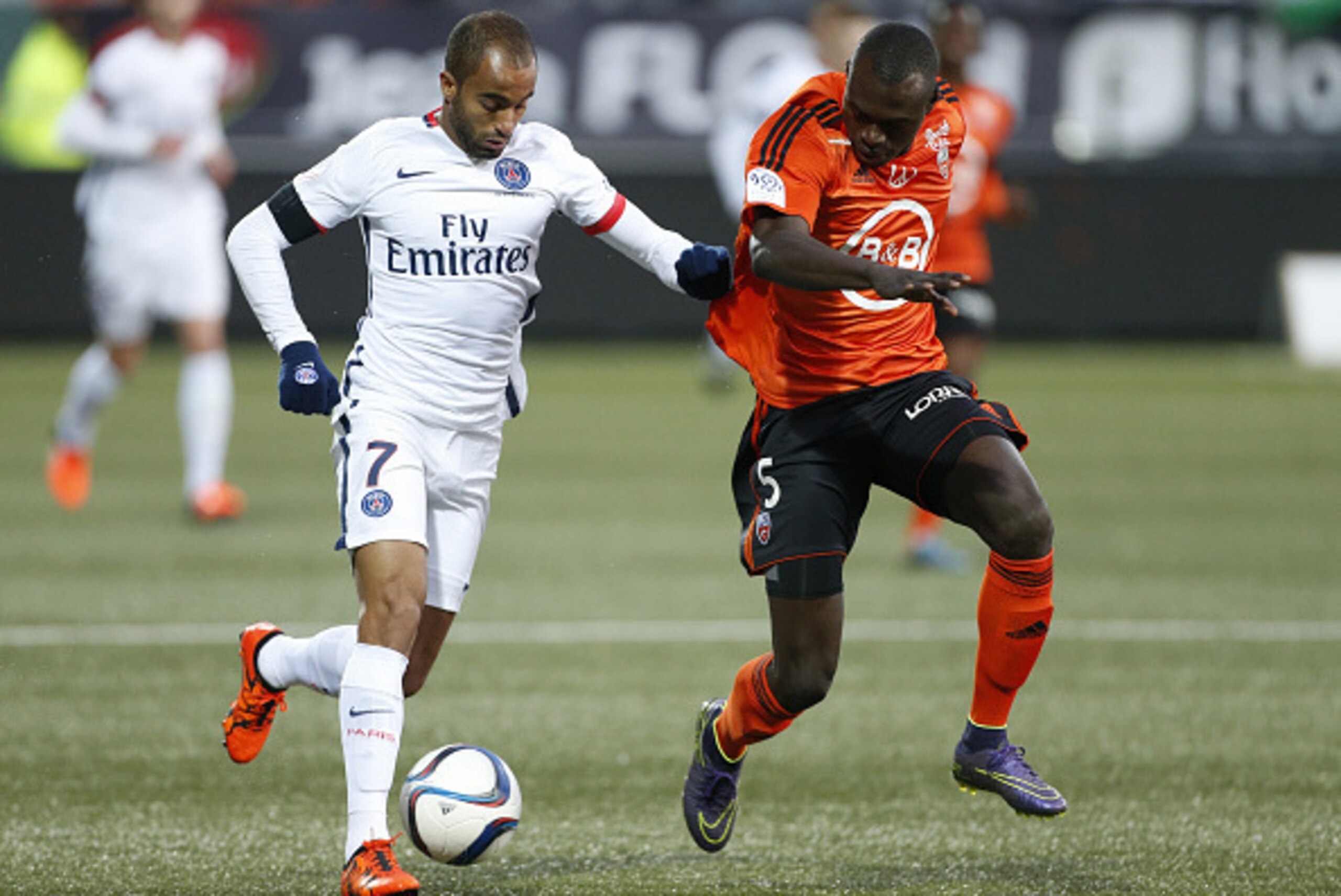 LORIENT, FRANCE - NOVEMBER 21: Lucas Moura of PSG and Zargo Toure of FC Lorient in action during the French Ligue 1 match between FC Lorient and Paris Saint-Germain (PSG) at Stade du Moustoir on November 21, 2015 in Lorient, France. (Photo by Jean Catuffe