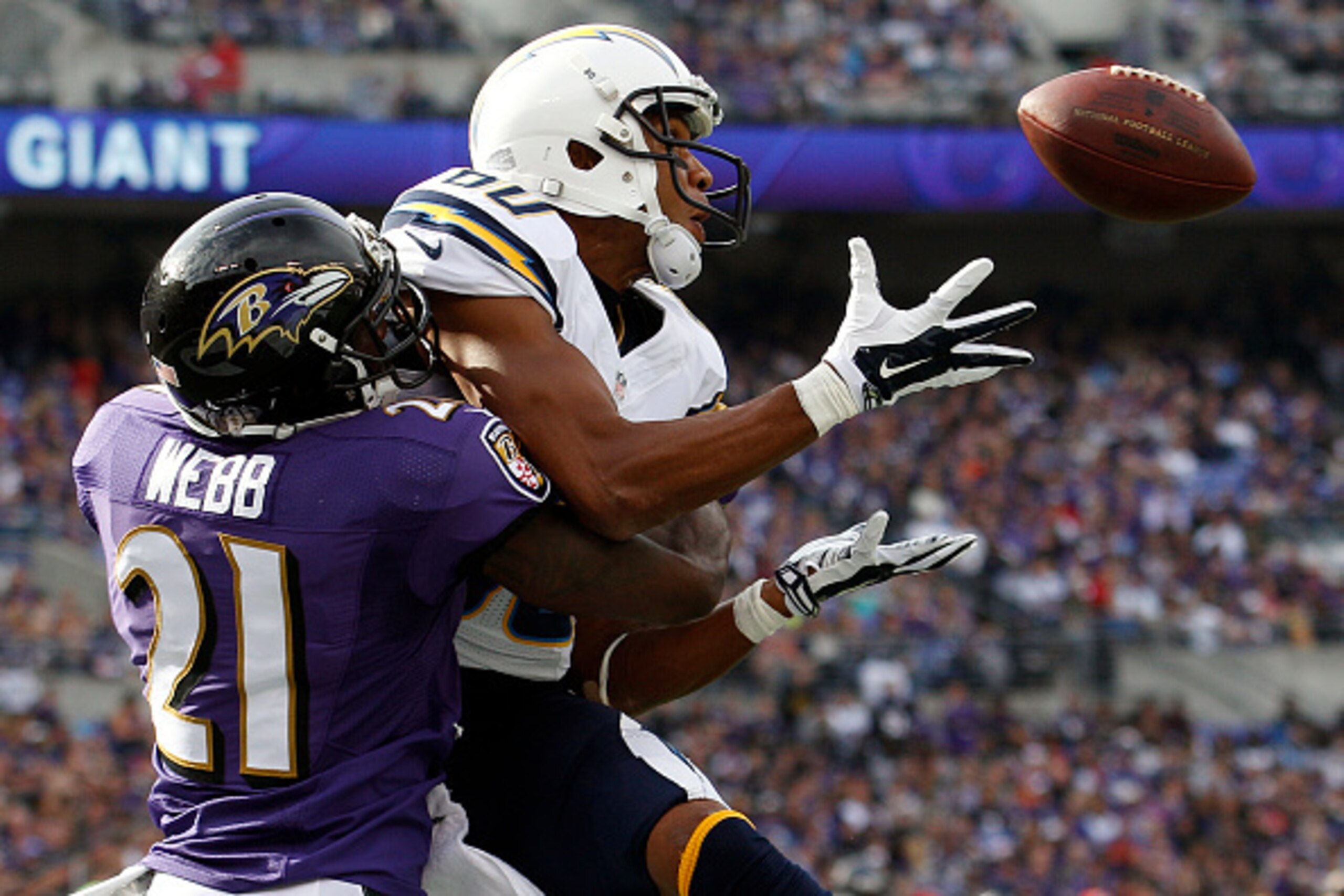 BALTIMORE, MD - NOVEMBER 1: Wide receiver Malcom Floyd #80 of the San Diego Chargers scores a second quarter touchdown past cornerback Lardarius Webb #21 of the Baltimore Ravens during a game at M&T Bank Stadium on November 1, 2015 in Baltimore, Maryland.