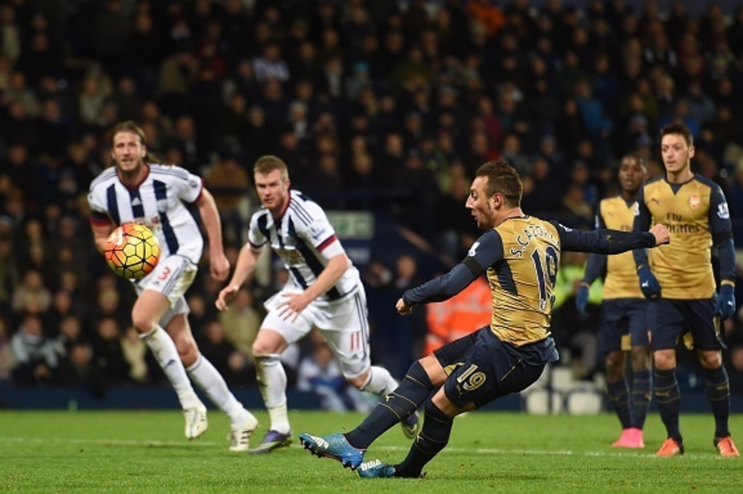 Arsenal's Spanish midfielder Santi Cazorla (C) slips and hits his penalty over the bar during the English Premier League football match between West Bromwich Albion and Arsenal at The Hawthorns in West Bromwich, central England on November 21, 2015. AFP P