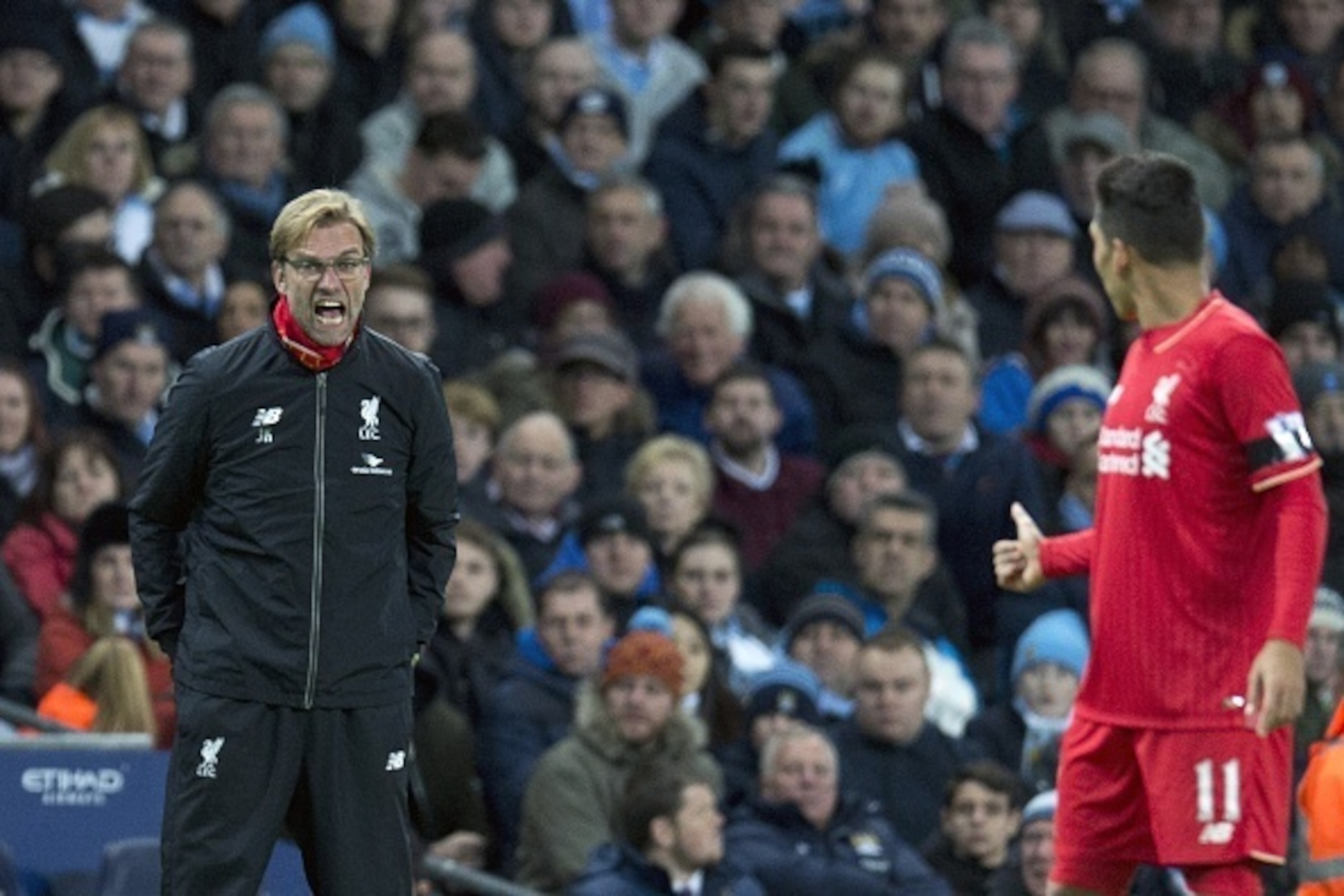 Liverpool's German manager Jurgen Klopp (L) shouts at Liverpool's Brazilian striker Roberto Firmino during the English Premier League football match between Manchester City and Liverpool at The Etihad stadium in Manchester, north west England on November 