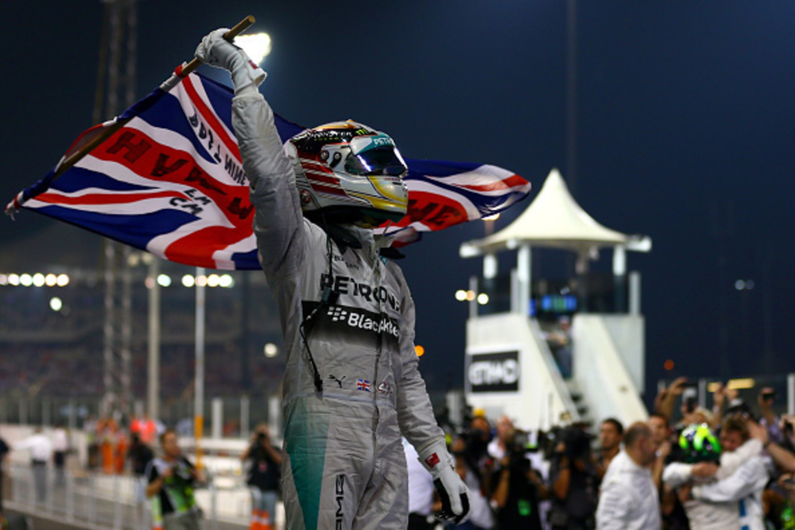 ABU DHABI, UNITED ARAB EMIRATES - NOVEMBER 23:  Lewis Hamilton of Great Britain and Mercedes GP celebrates in Parc Ferme after winning the World Championship and the Abu Dhabi Formula One Grand Prix at Yas Marina Circuit on November 23, 2014 in Abu Dhabi,