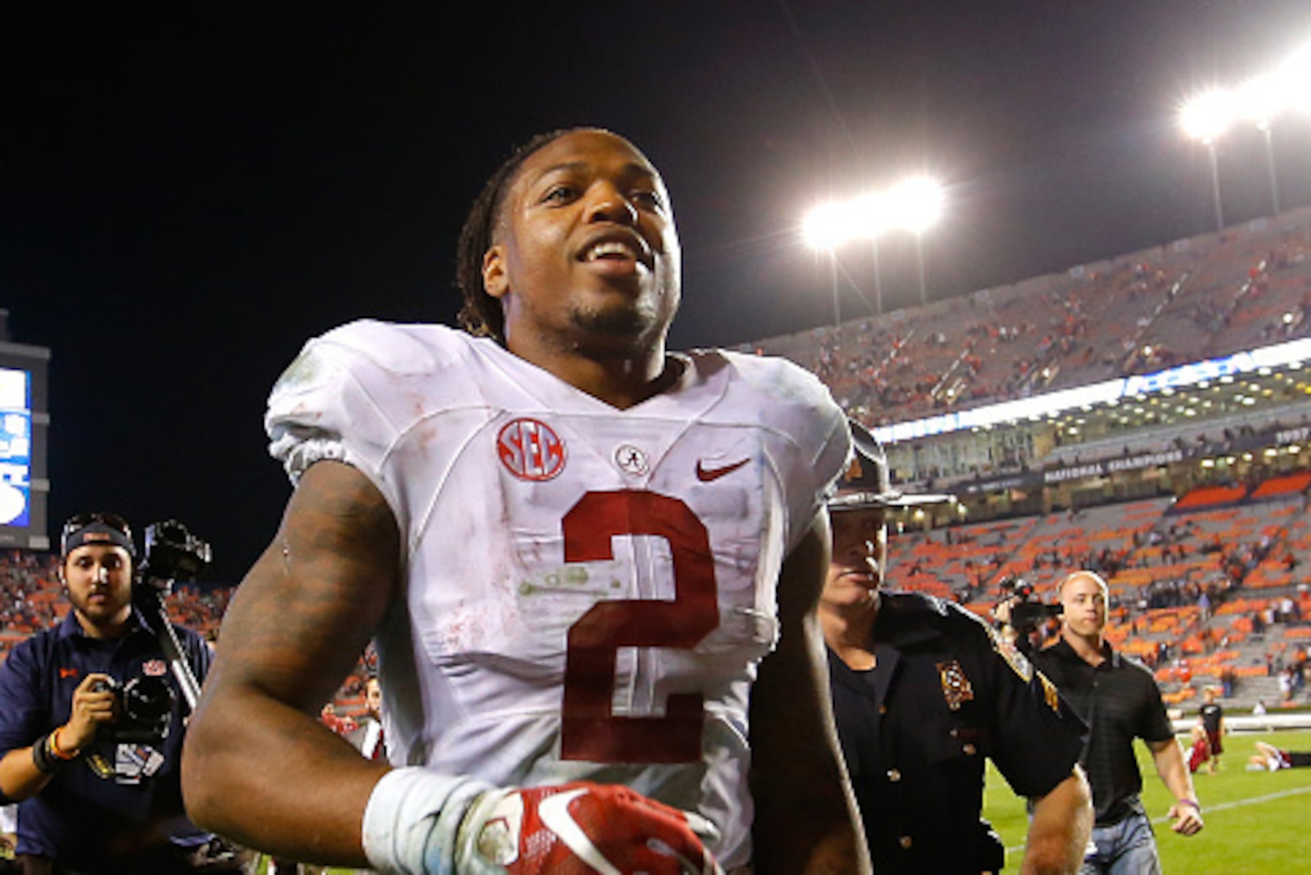 AUBURN, AL - NOVEMBER 28:  Derrick Henry #2 of the Alabama Crimson Tide runs off the field after their 29-13 win over the Auburn Tigers at Jordan Hare Stadium on November 28, 2015 in Auburn, Alabama.  (Photo by Kevin C. Cox/Getty Images)