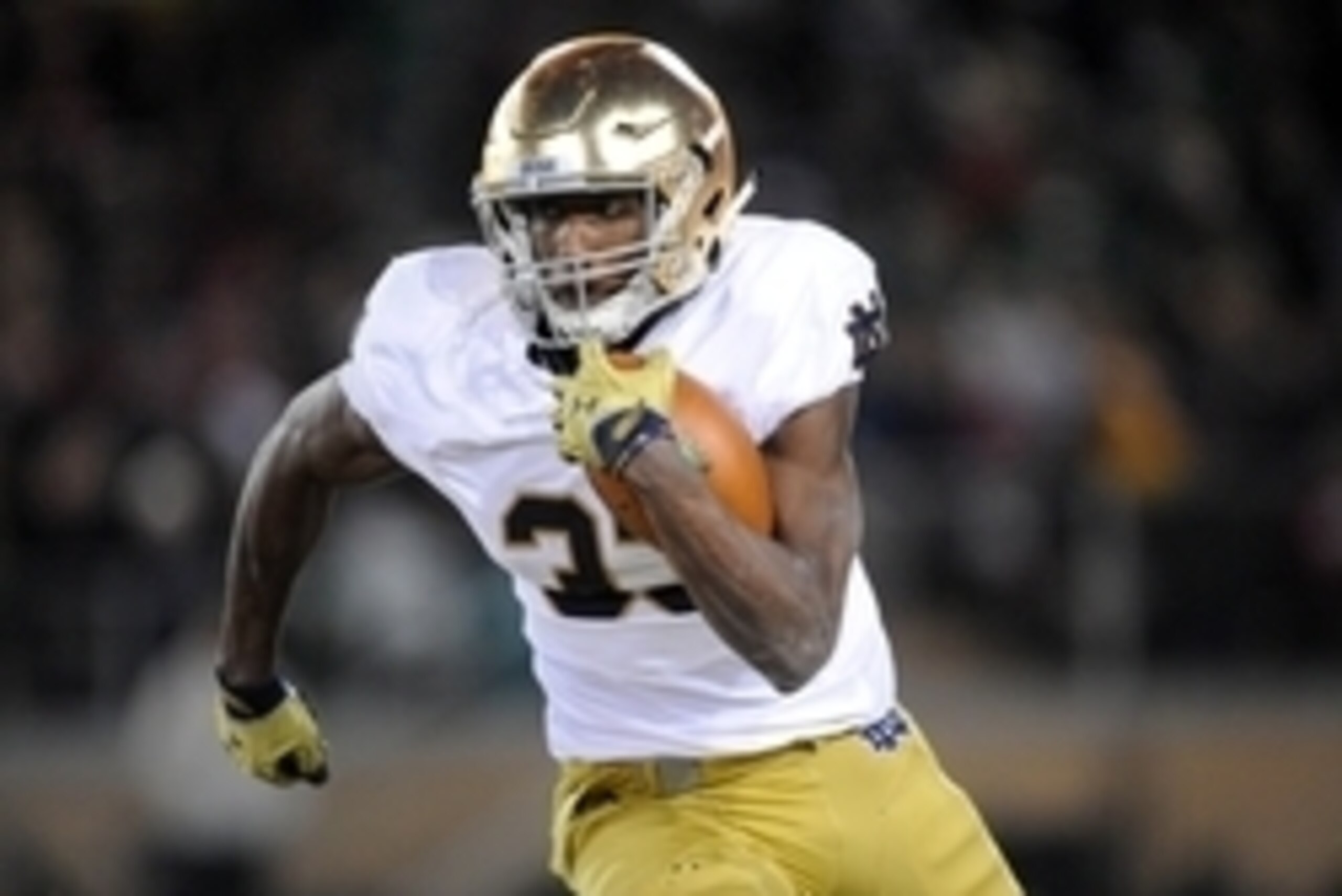 November 28, 2015; Stanford, CA, USA; Notre Dame Fighting Irish running back Josh Adams (33) runs the ball against Stanford Cardinal during the first half at Stanford Stadium. Mandatory Credit: Gary A. Vasquez-USA TODAY Sports