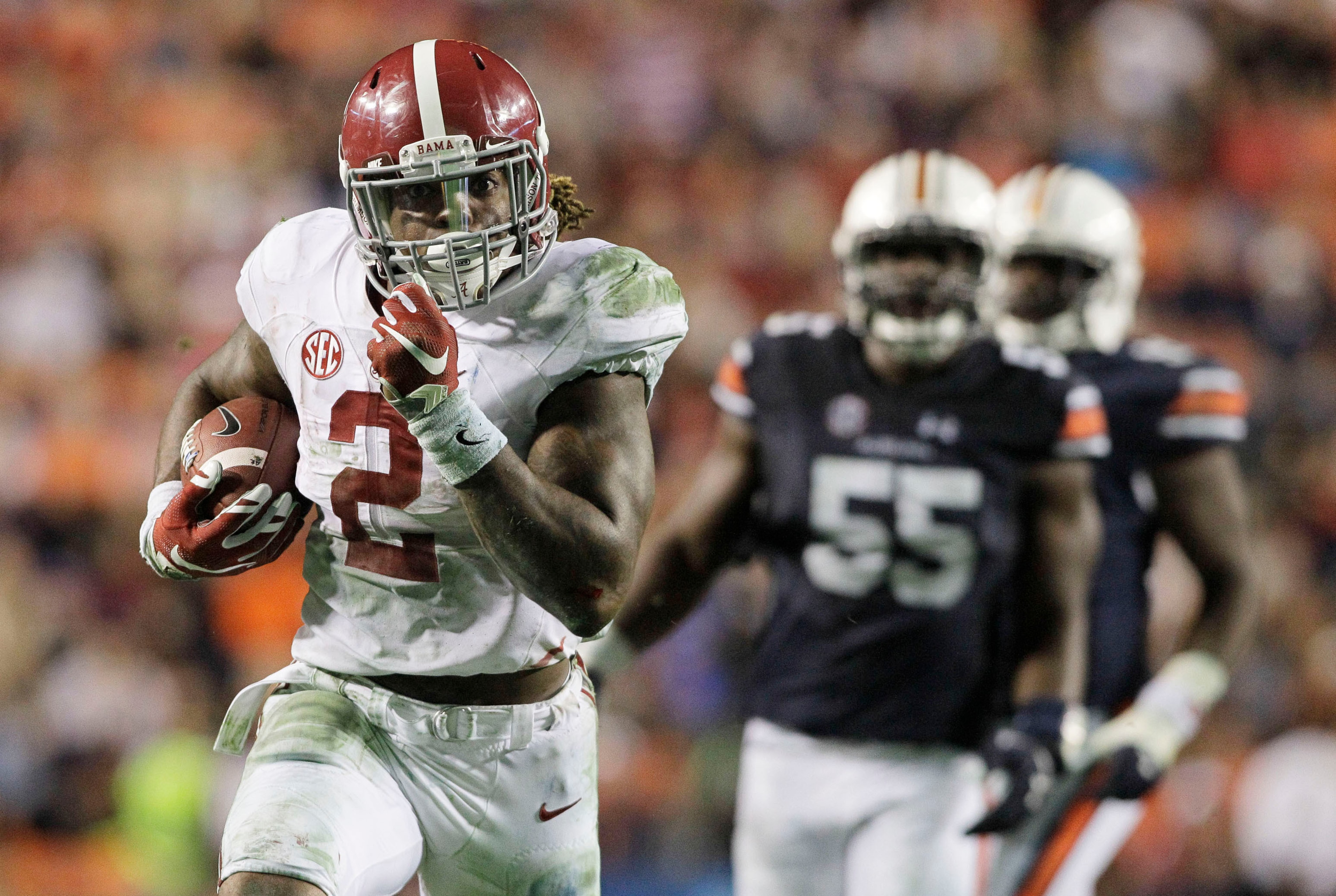 Nov 28, 2015; Auburn, AL, USA; Alabama Crimson Tide running back Derrick Henry (2) races past Auburn Tigers defenders and scores a touchdown in the fourth quarter to beat the Auburn Tigers 29-13 Jordan Hare Stadium. Mandatory Credit: John Reed-USA TODAY S
