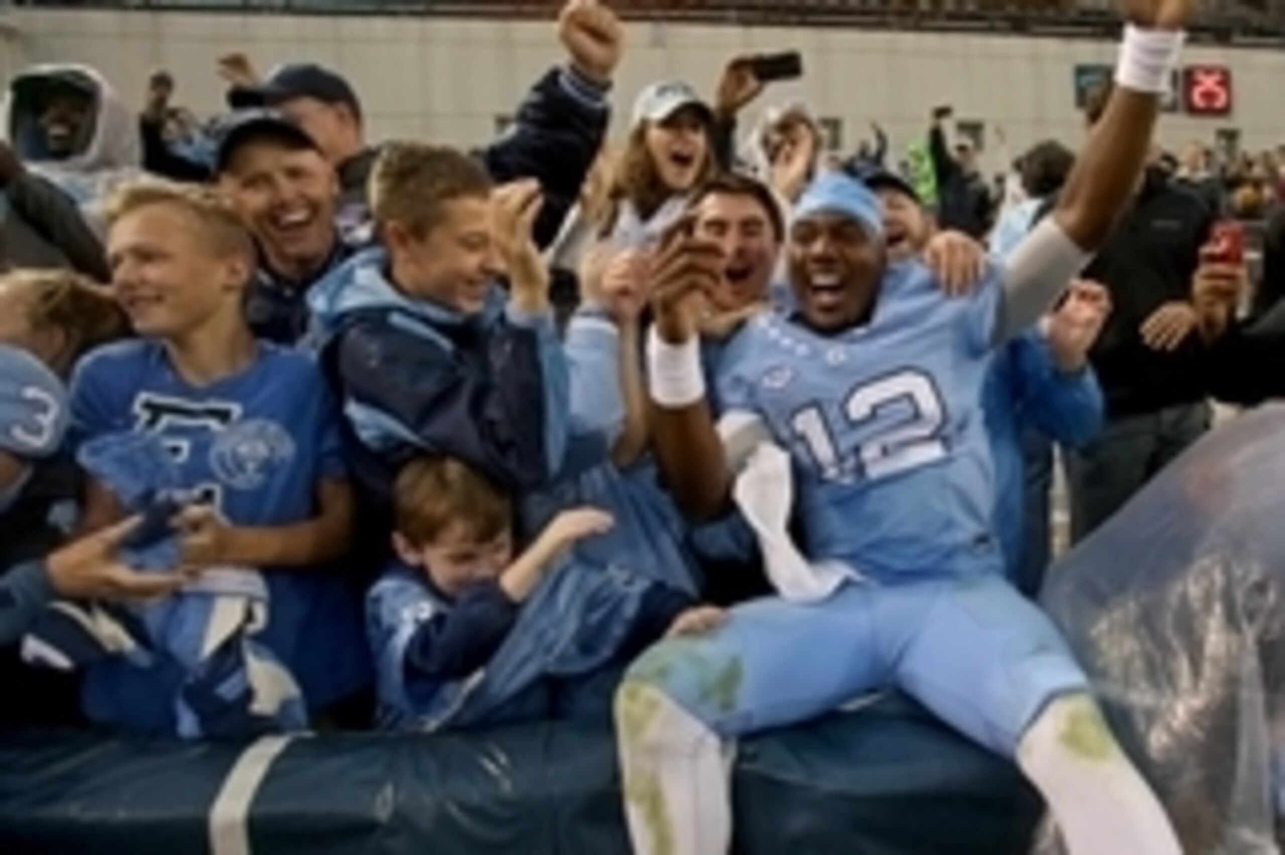 Oct 3, 2015; Atlanta, GA, USA; North Carolina Tar Heels quarterback Marquise Williams (12) celebrates with fans after their win over the Georgia Tech Yellow Jackets at Bobby Dodd Stadium. North Carolina won 38-31. Mandatory Credit: Jason Getz-USA TODAY Sp