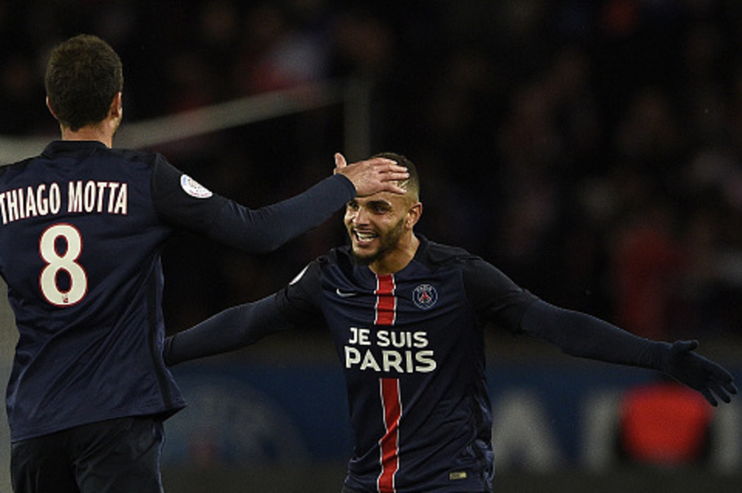 Paris Saint-Germain's French defender Layvin Kurzawa (R) celebrates with Paris Saint-Germain's Italian midfielder Thiago Motta during the French L1 football match between Paris Saint-Germain (PSG) and Troyes at the Parc des Princes stadium in Paris on Nov