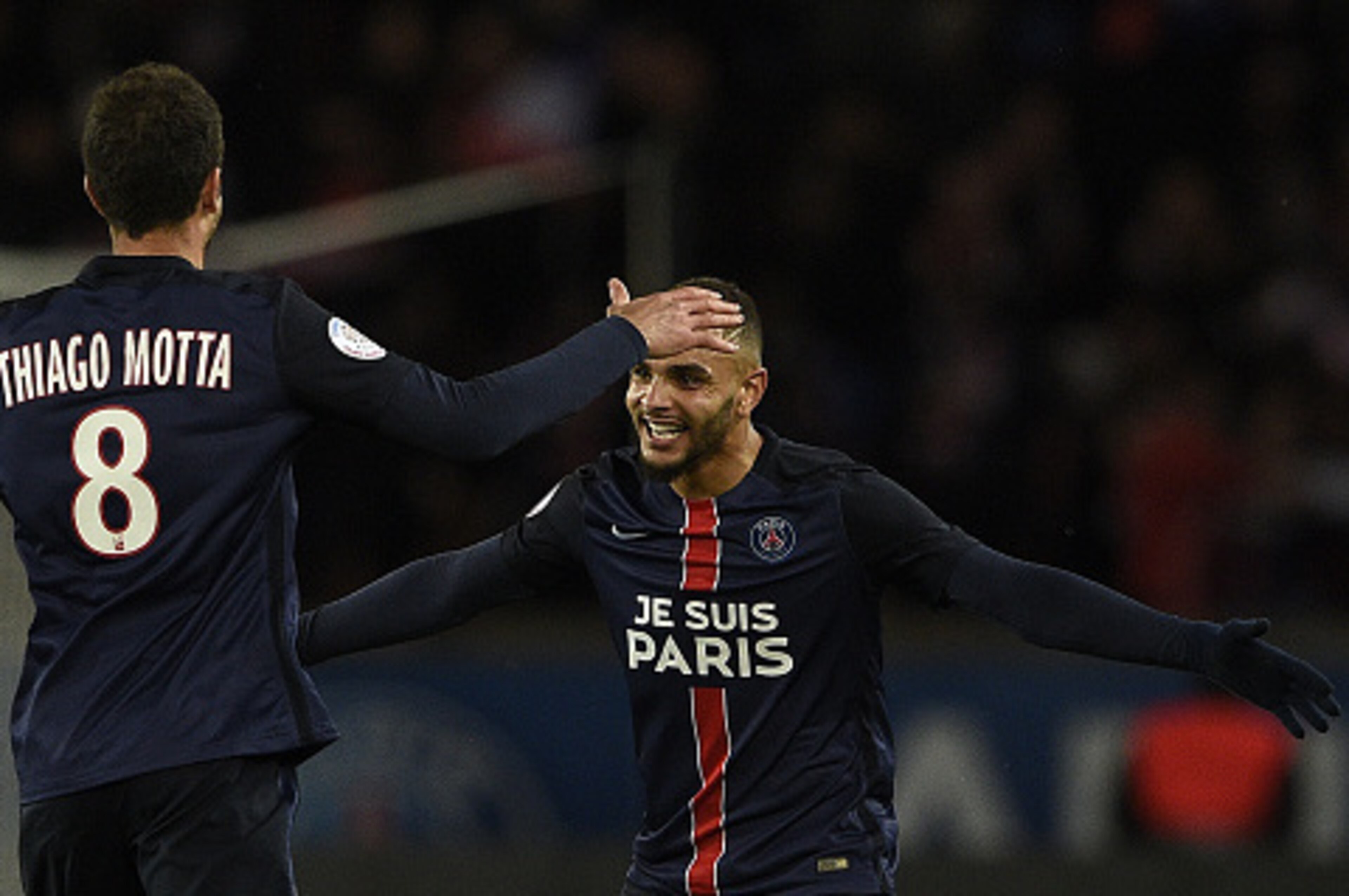 Paris Saint-Germain's French defender Layvin Kurzawa (R) celebrates with Paris Saint-Germain's Italian midfielder Thiago Motta during the French L1 football match between Paris Saint-Germain (PSG) and Troyes at the Parc des Princes stadium in Paris on Nov