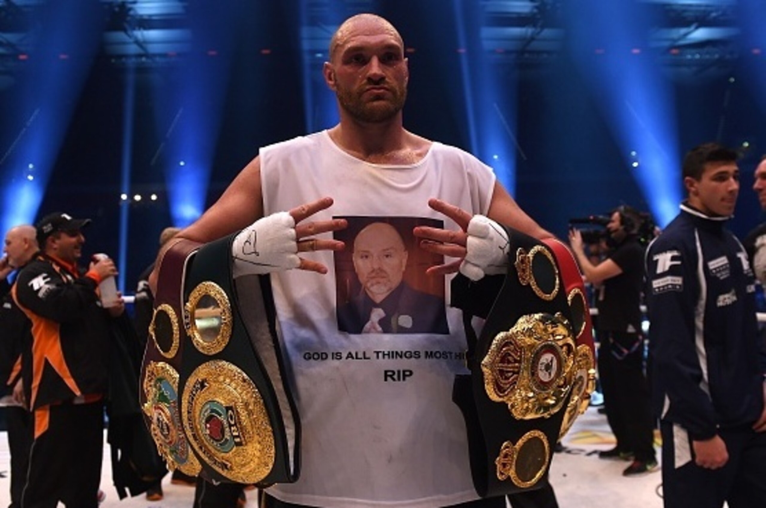 British Tyson Fury celebrates after the WBA, IBF, WBO and IBO title bout against Ukrainian world heavyweight boxing champion Wladimir Klitschko in Duesseldorf, western Germany, on November 28, 2015. Fury won the fight after 12 Rounds of Boxing. AFP PHOTO 