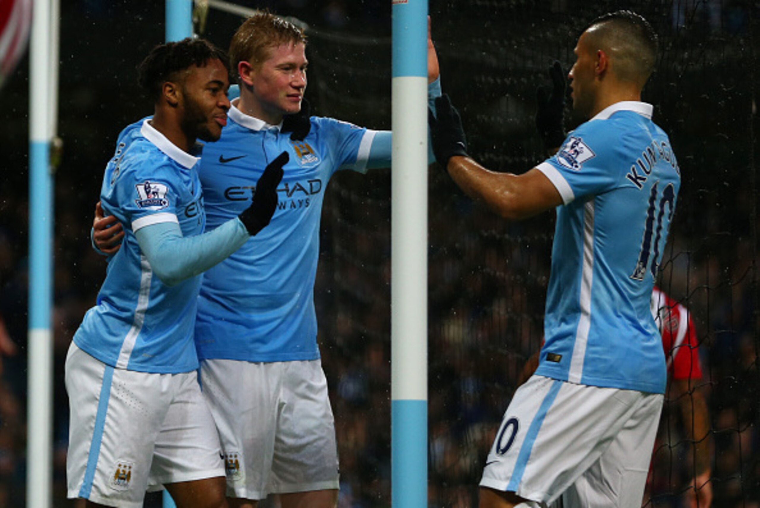 MANCHESTER, ENGLAND - NOVEMBER 28:  Kevin de Bruyne (C) of Manchester City celebrates scoring his team's first goal with his team mates Raheem Sterling (L) and Sergio Aguero (R) during the Barclays Premier League match between Manchester City and Southamp