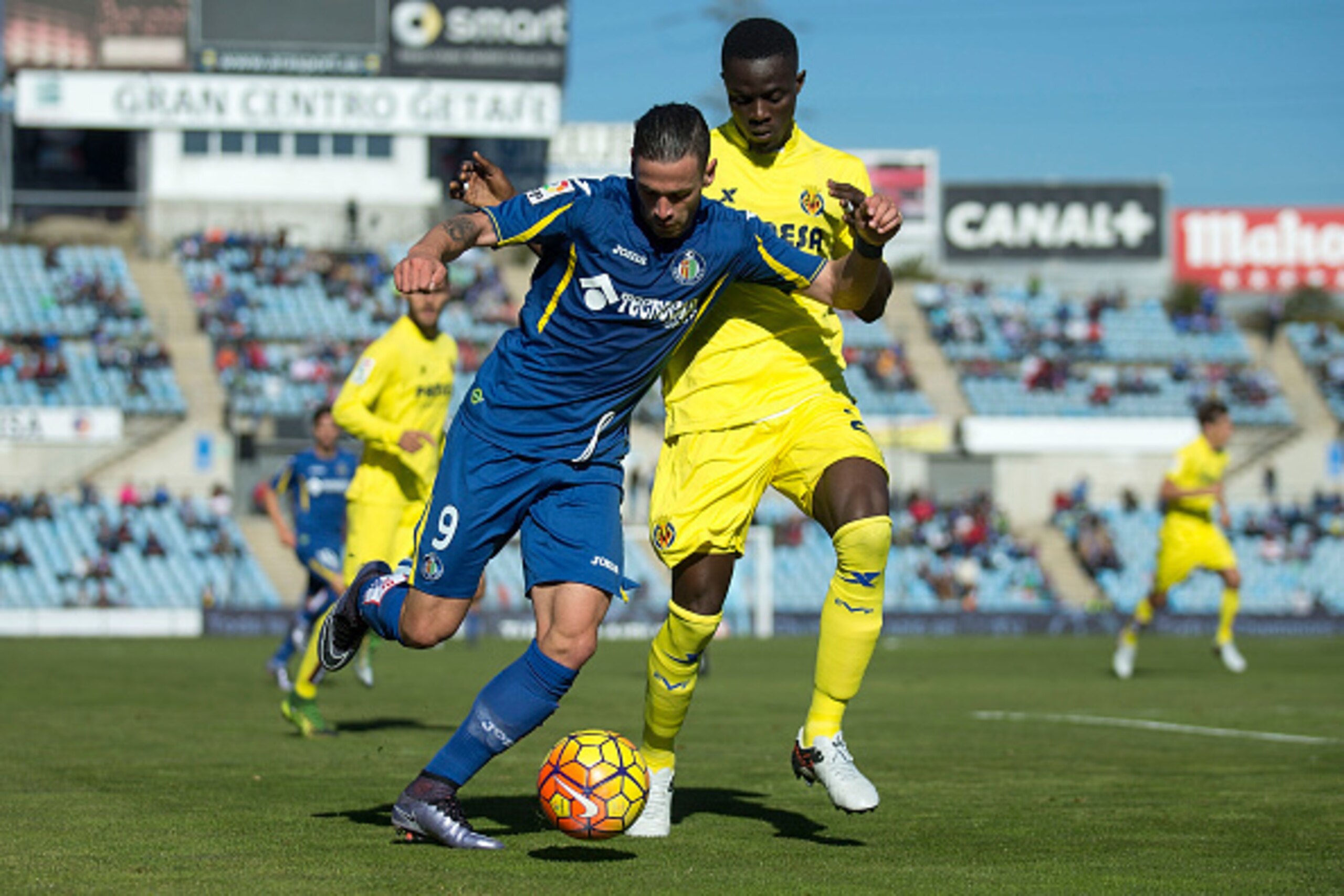 GETAFE, SPAIN - NOVEMBER 29: Alvaro Vazquez (L) of Getafe CF competes for the ball with Eric Bertrand Bailly (R) of Villarreal CF during the La Liga match between Getafe CF and Villareal CF at Coliseum Alfonso Perez on November 29, 2015 in Getafe, Spain. 