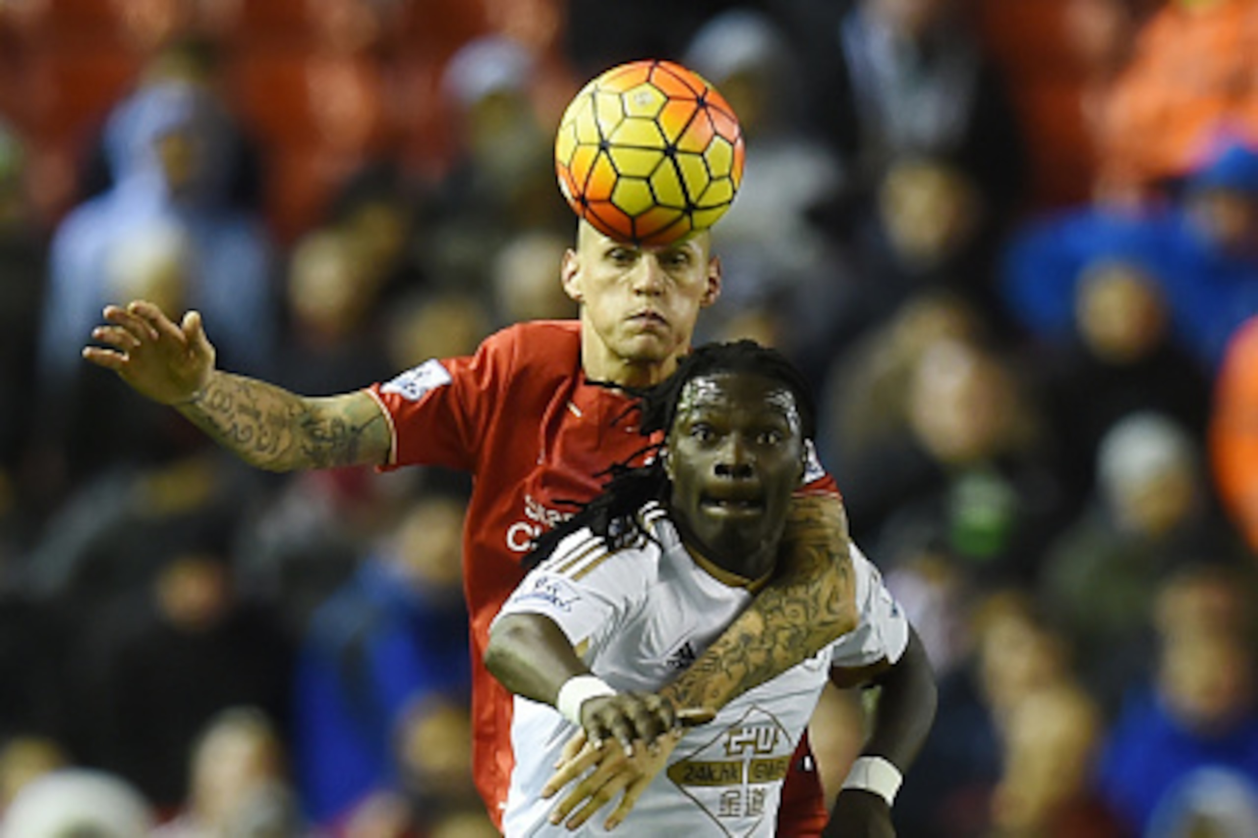 Liverpool's Slovakian defender Martin Skrtel (L) vies with Swansea City's French striker Bafetimbi Gomis during the English Premier League football match between Liverpool and Swansea City at the Anfield stadium in Liverpool, north-west England on Novembe