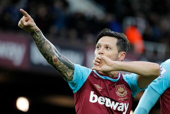 West Ham United's Argentinian striker Mauro Zarate celebrates after scoring the opening goal of the English Premier League football match between West Ham United and West Bromwich Albion at The Boleyn Ground in Upton Park, East London on November 29, 2015