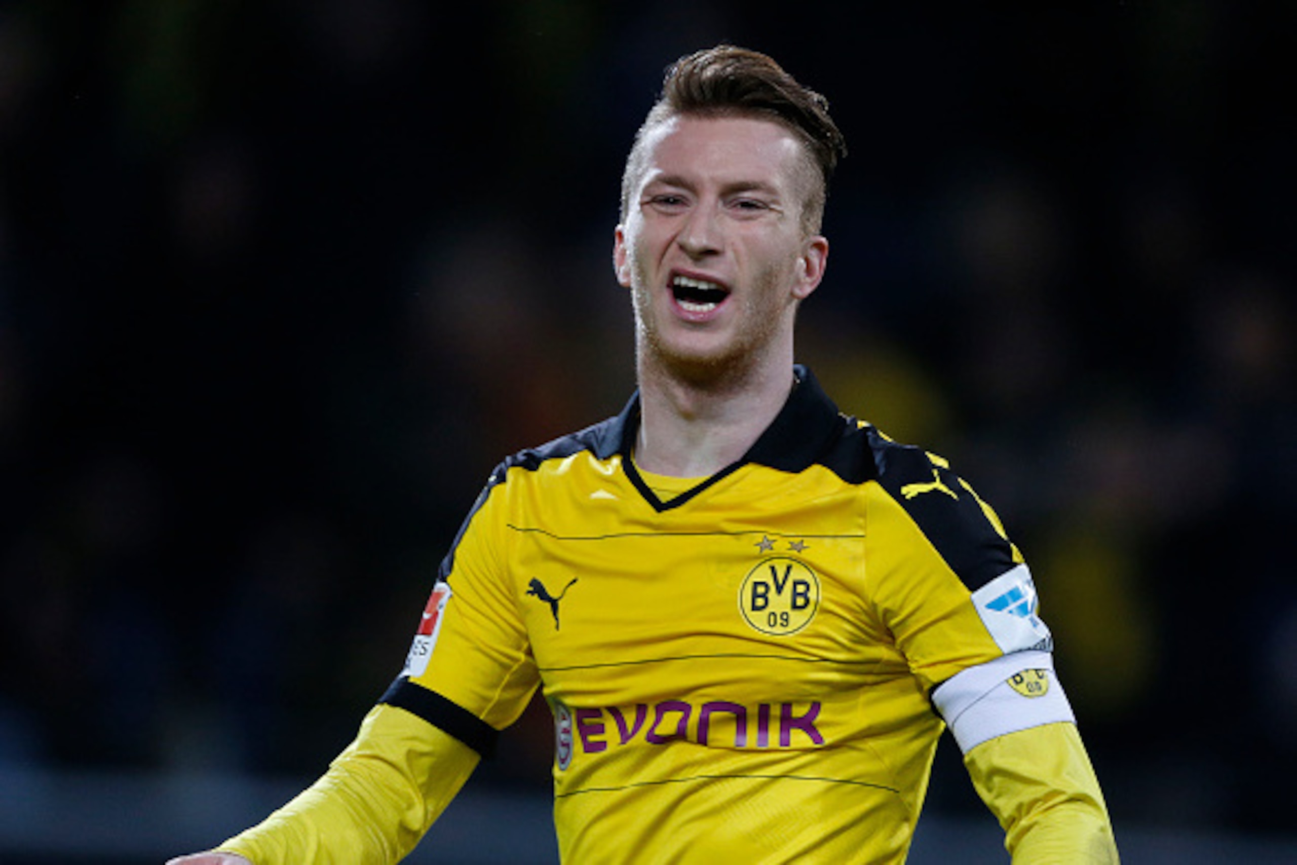 Dortmund's striker Marco Reus reacts during the German first division Bundesliga football match Borussia Dortmund vs VfB Stuttgart, in Dortmund, western Germany, on November 29, 2015. Dortmund won the match 4-1.  AFP PHOTO / NORBERT SCHMIDT

RESTRICTIONS: