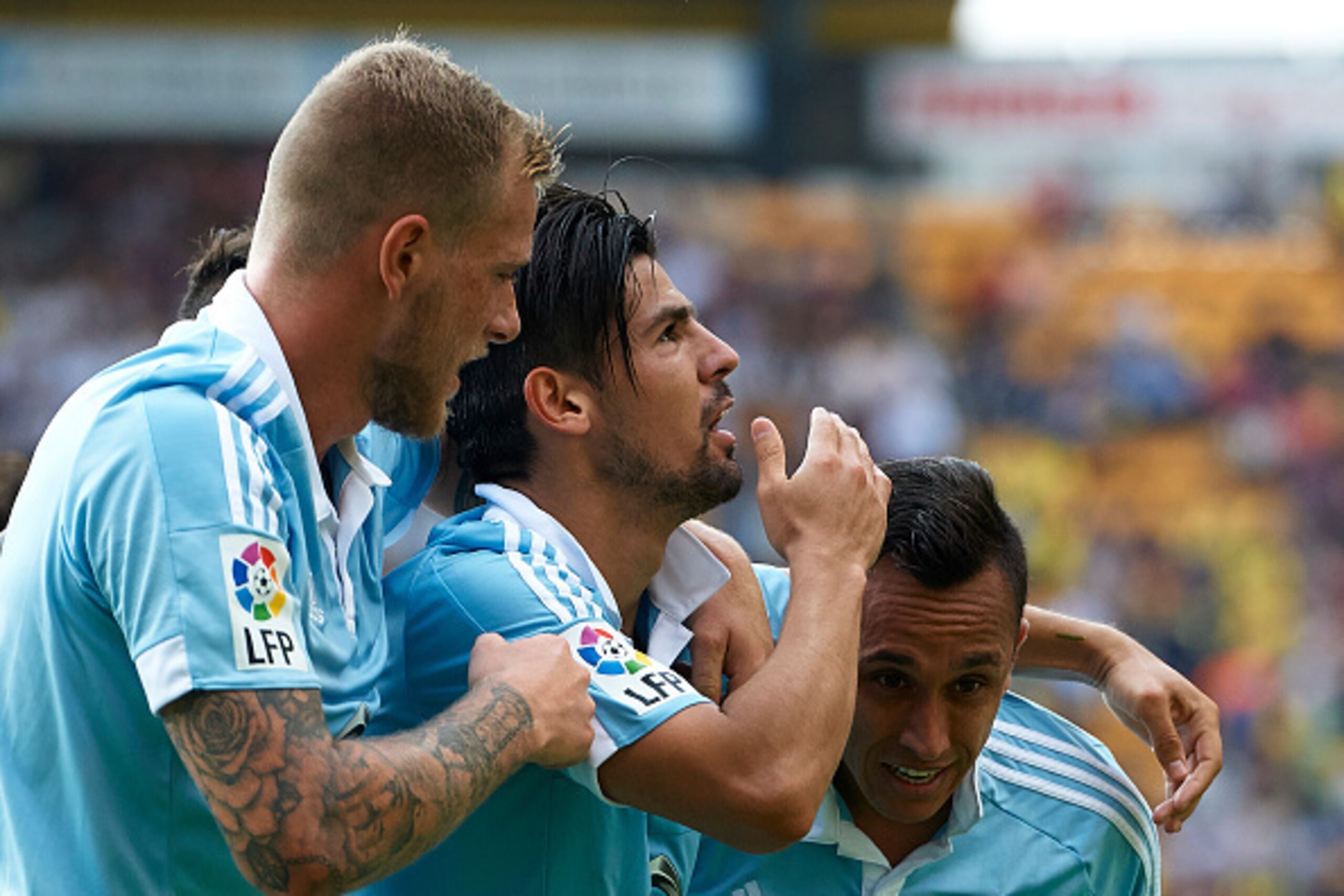 VILLARREAL, SPAIN - OCTOBER 18:  Nolito of Celta celebrates scoring his team's second goal with his teammates Fabian Orellana (R) and John Guidetti (L) during the La Liga match between Villarreal CF and RC Celta de Vigo at El Madrigal Stadium on October 1