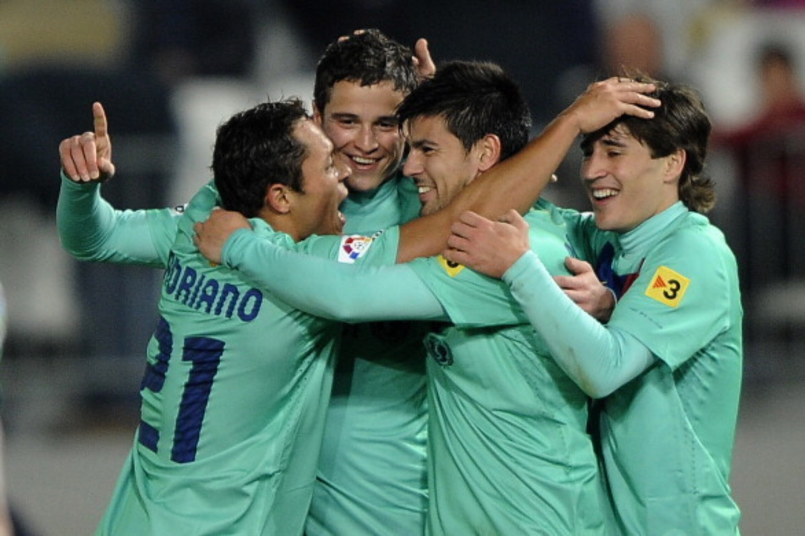 CORRECTION PLAYER'S NAME (2ndR)Barcelona's Dutch midfielder Ibrahim Afellay (2ndL) celebrates his goal  with teammates Brazilian defender Adriano (L), Barcelona's forward Nolito (2ndR) and Barcelona's forward Bojan Krkic Perez (R) during the Spanish King'