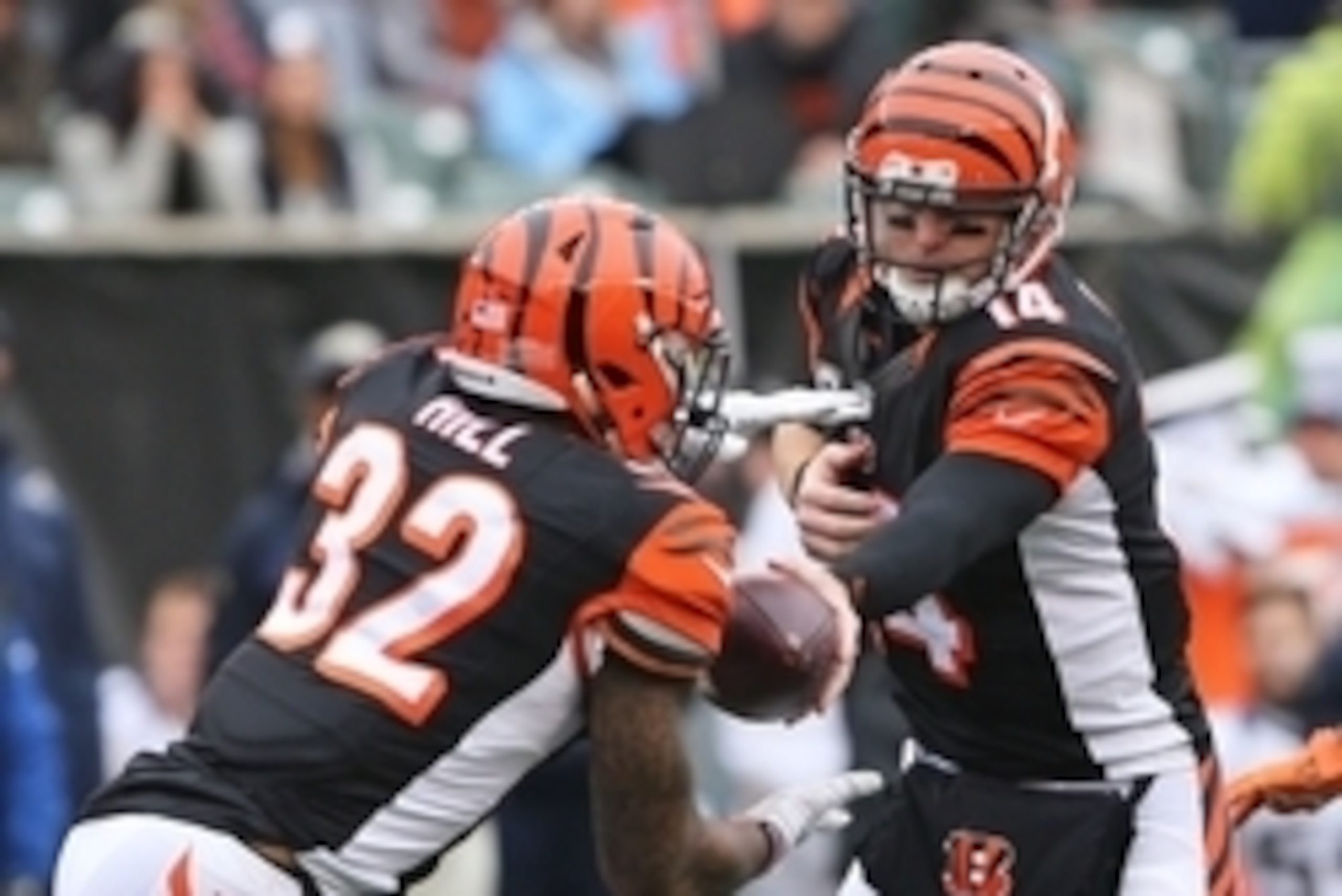 Nov 29, 2015; Cincinnati, OH, USA; Cincinnati Bengals quarterback Andy Dalton (14) hands the ball off to running back Jeremy Hill (32) in the first half against the St. Louis Rams at Paul Brown Stadium. Mandatory Credit: Aaron Doster-USA TODAY Sports
