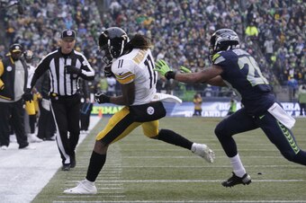Marcus Burley shoves Markus Wheaton out of bounds.