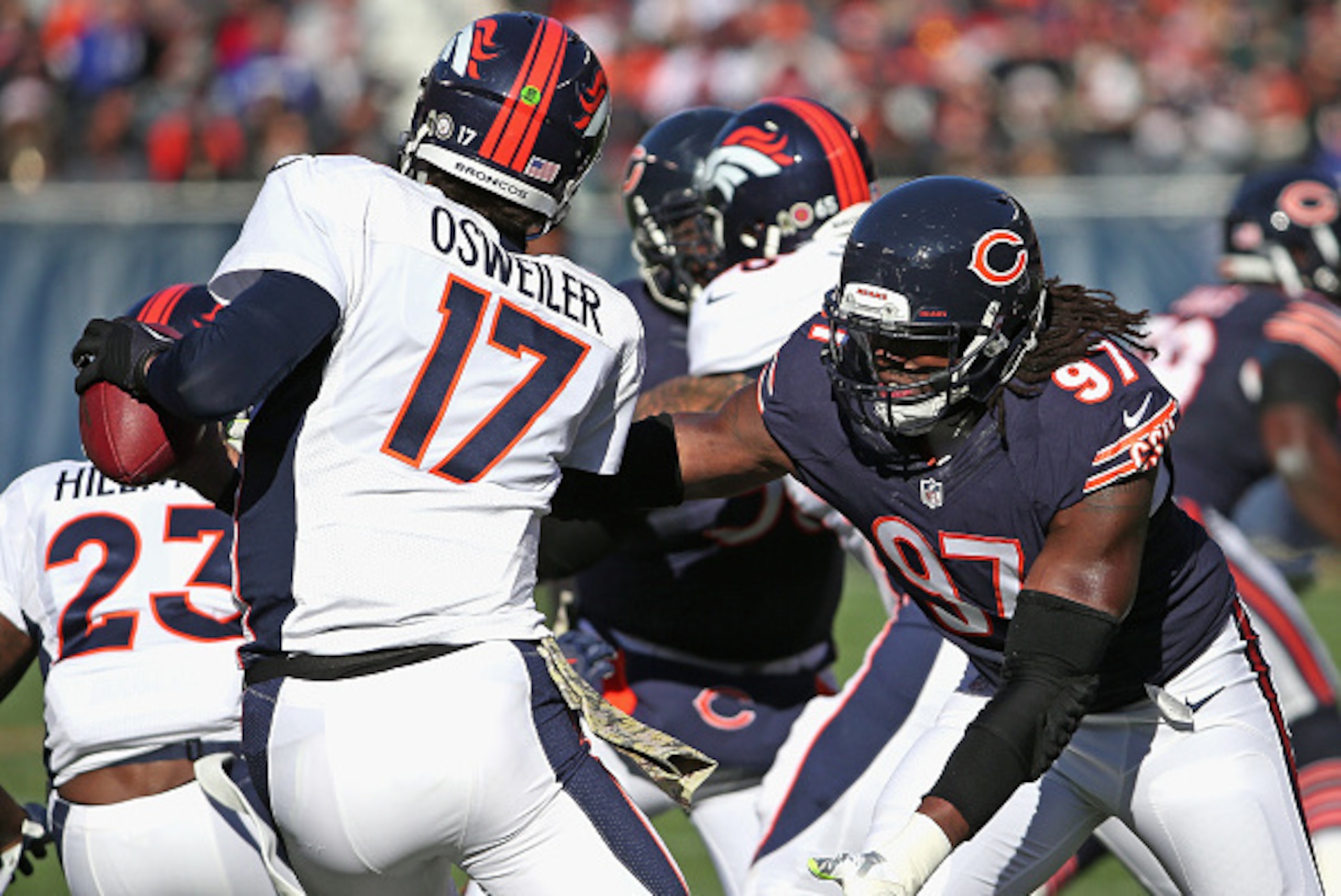 CHICAGO, IL - NOVEMBER 22: Willie Young #97 of the Chicago Bears pressures Brock Osweiler #17 of the Denver Broncos at Soldier Field on November 22, 2015 in Chicago, Illinois. The Broncos defeated the Bears 17-15. (Photo by Jonathan Daniel/Getty Images)
