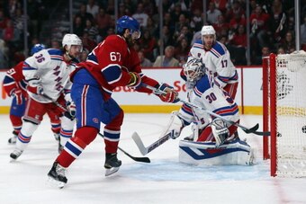 MONTREAL, QC - MAY 19:  Max Pacioretty #67 of the Montreal Canadiens scores a goal against Henrik Lundqvist #30 of the New York Rangers during the first period in Game Two of the Eastern Conference Final during the 2014 Stanley Cup Playoffs at Bell Centre