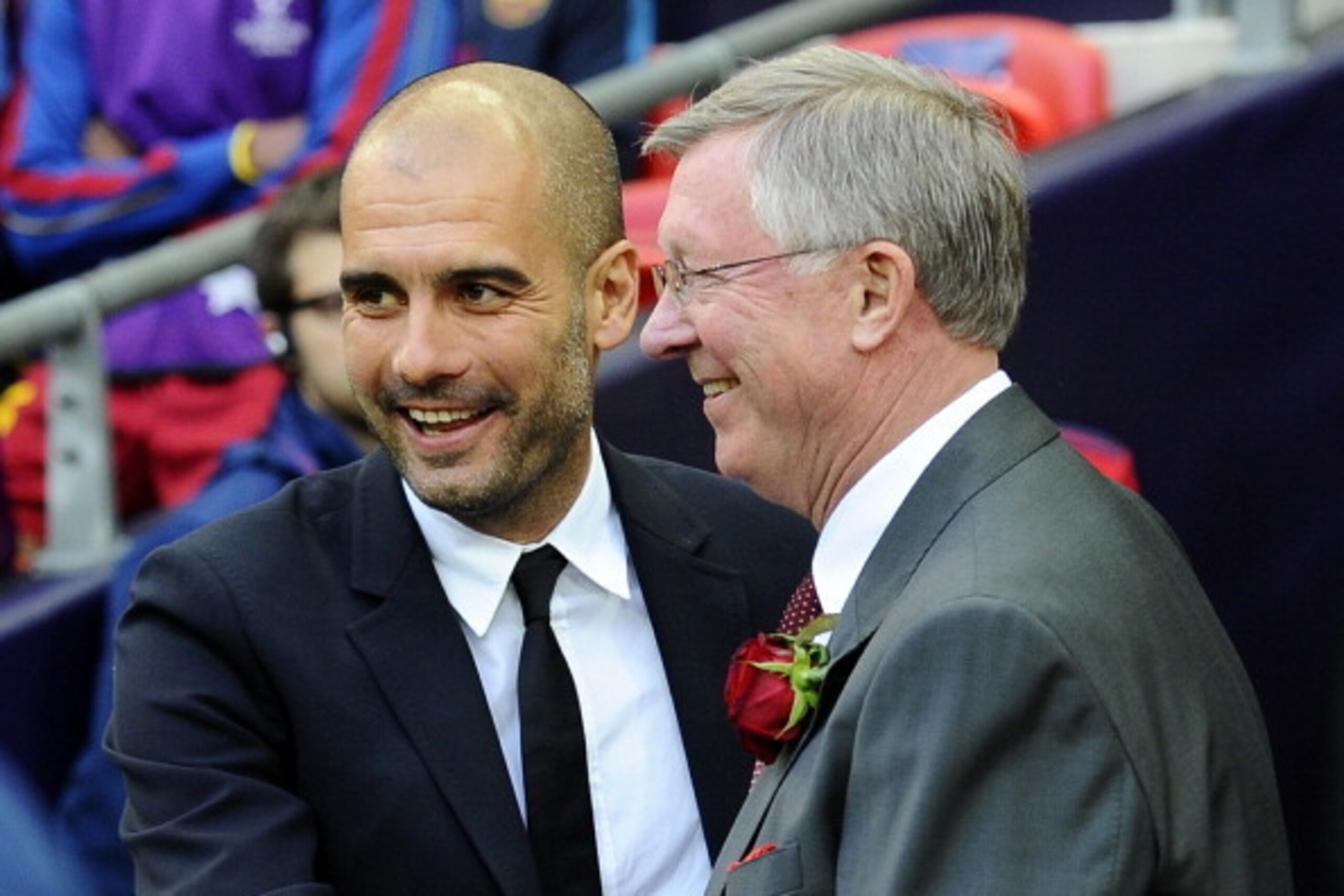 Barcelona's Spanish coach Josep Guardiola (L) embraces Manchester United manager Alex Ferguson during the UEFA Champions League final football match FC Barcelona vs. Manchester United, on May 28, 2011 at Wembley stadium in London. AFP PHOTO / CARL DE SOUZ