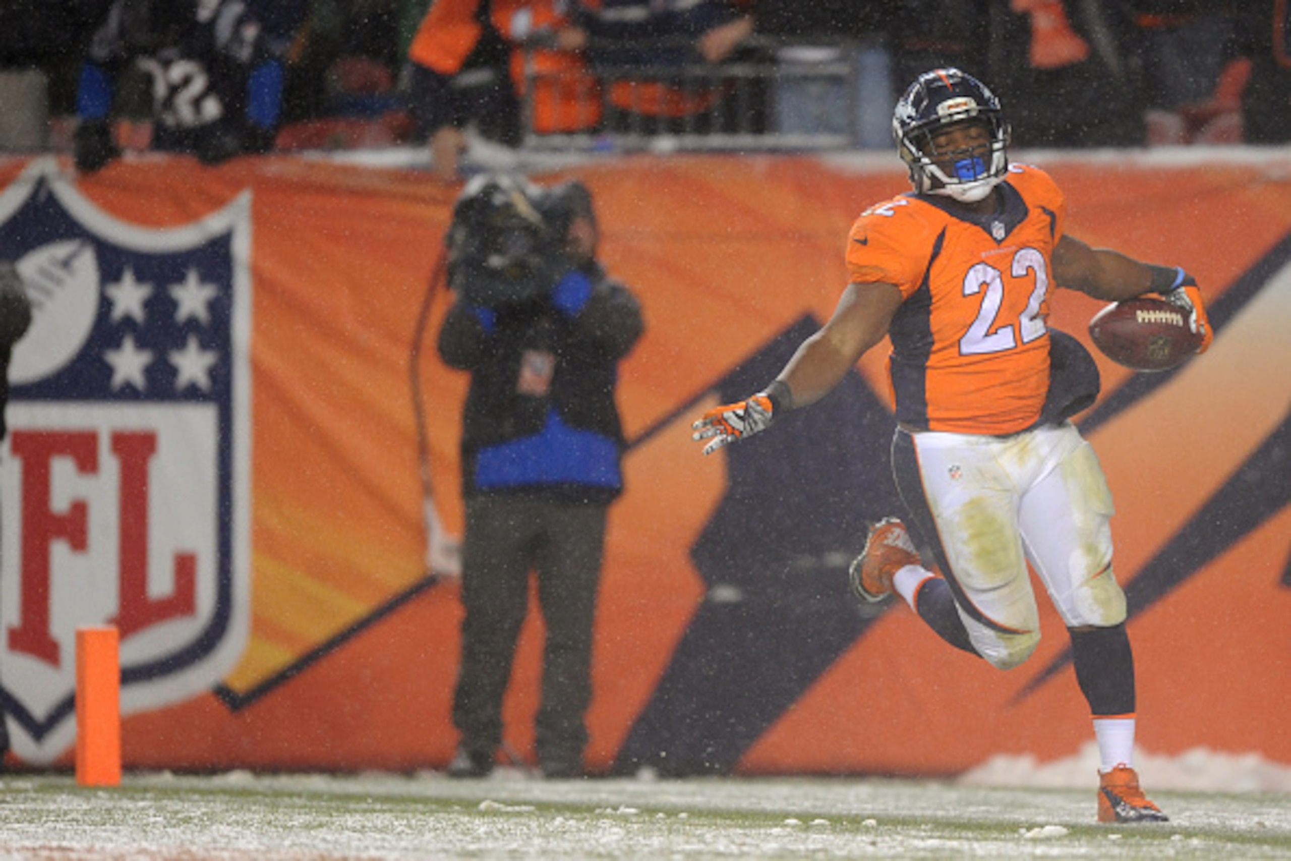 DENVER, CO - NOVEMBER 29: Running back C.J. Anderson #22 of the Denver Broncos carries the ball for an overtime touchdown to defeat the New England Patriots 30-24 at Sports Authority Field at Mile High on November 29, 2015 in Denver, Colorado. (Photo by D