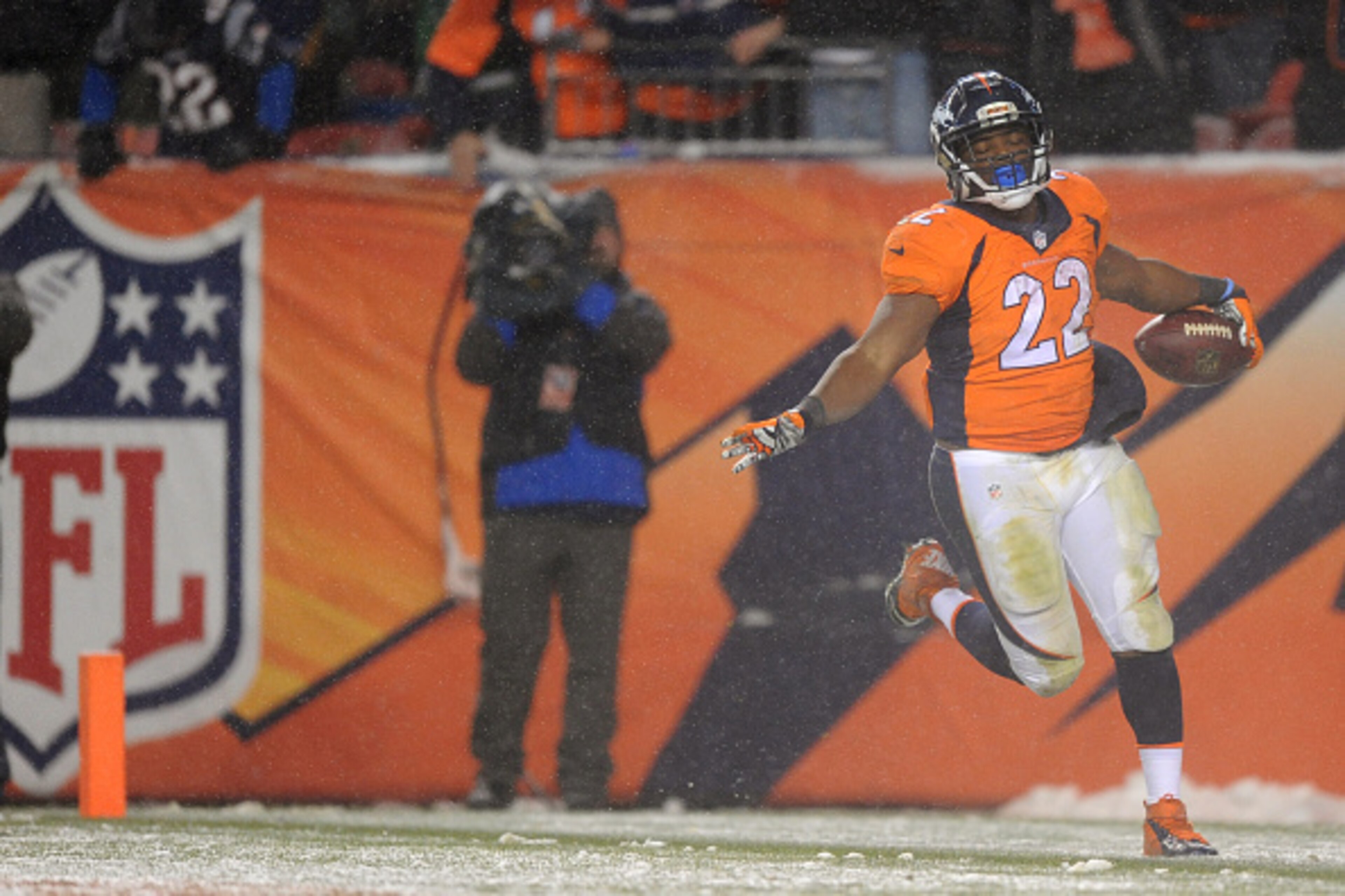 DENVER, CO - NOVEMBER 29: Running back C.J. Anderson #22 of the Denver Broncos carries the ball for an overtime touchdown to defeat the New England Patriots 30-24 at Sports Authority Field at Mile High on November 29, 2015 in Denver, Colorado. (Photo by D