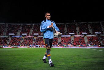 PALMA DE MALLORCA, SPAIN - OCTOBER 11:  Victor Valdes of Spain leaves the pitch after the warm up prior to the FIFA 2014 World Cup Qualifier match between Spain and Belarus at Iberostars Stadium on October 11, 2013 in Palma de Mallorca, Spain.  (Photo by 