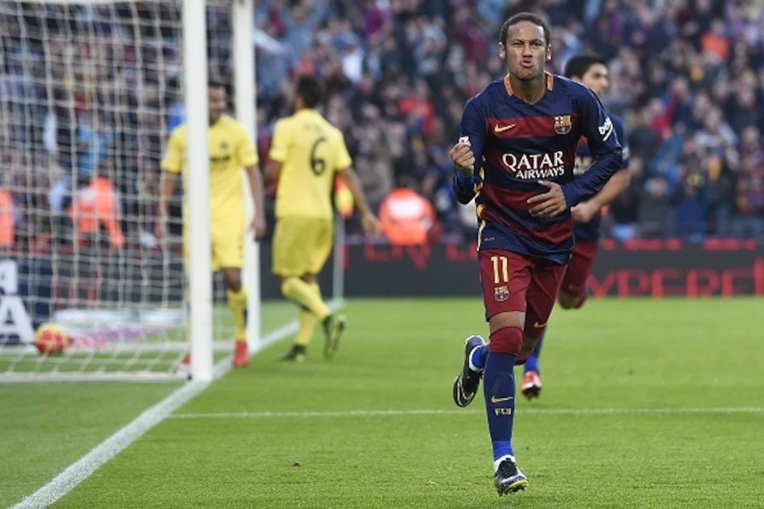 Barcelona's Brazilian forward Neymar da Silva Santos Junior celebrates his goal during the Spanish league football match FC Barcelona vs Villarreal CF at the Camp Nou stadium in Barcelona on November 8, 2015.   AFP PHOTO/ JOSEP LAGO        (Photo credit s