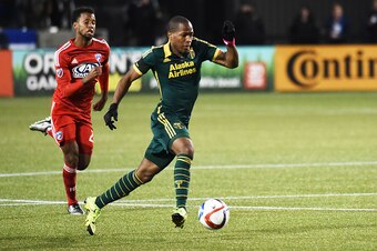 PORTLAND, OR - NOVEMBER 22: Darlington Nagbe #6 of Portland Timbers brings the ball up the pitch as Kellyn Acosta #23 of FC Dallas gives chase during the first half of the match at Providence Park on November 22, 2015 in Portland, Oregon. (Photo by Steve 