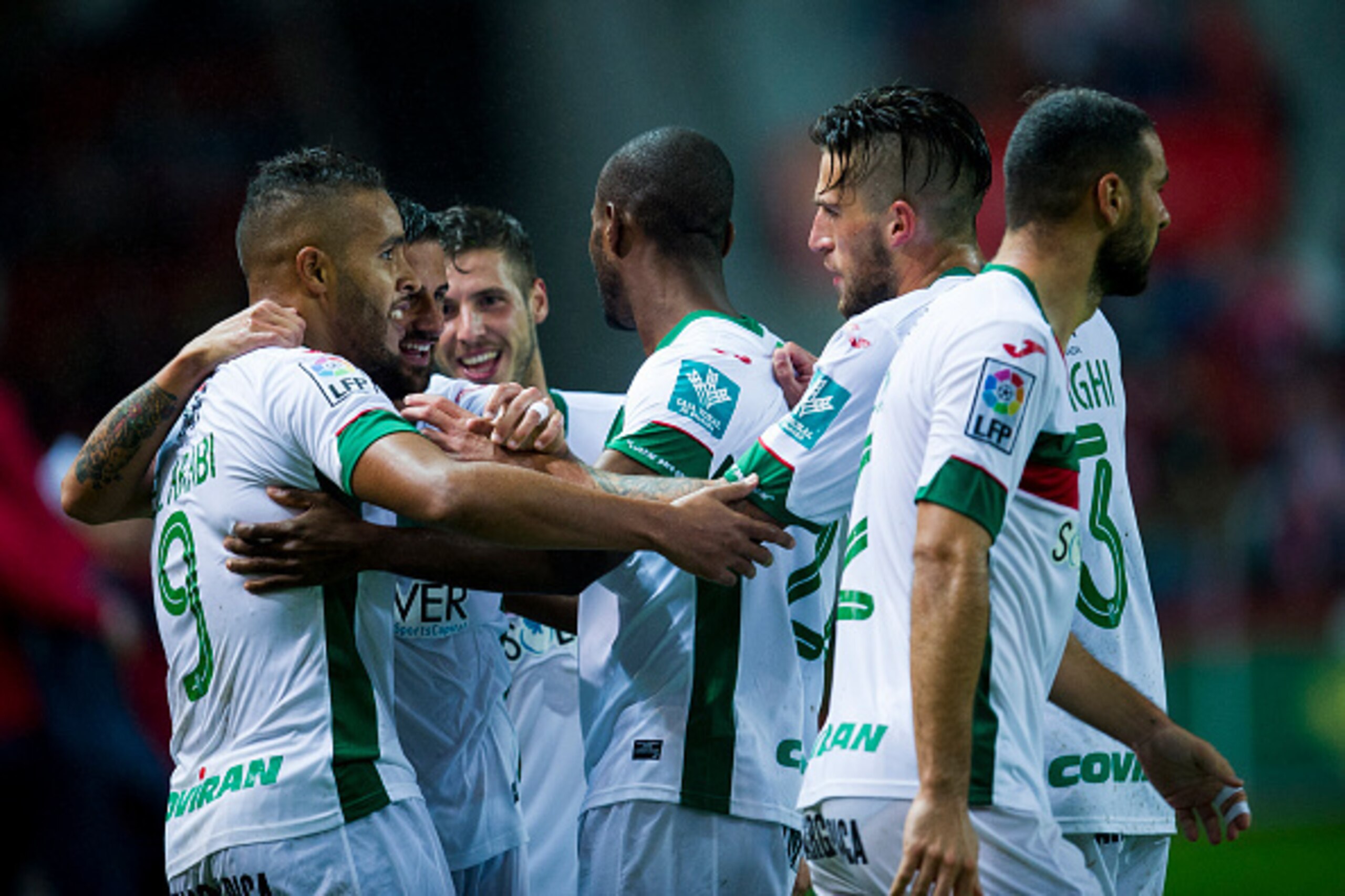 GIJON, SPAIN - OCTOBER 19:  Youssef El Arabi (L) of Granada CF celebrates after scoring during the La Liga match between Real Sporting de Gijon and Granada CF at Estadio El Molinon on October 19, 2015 in Gijon, Spain.  (Photo by Juan Manuel Serrano Arce/G