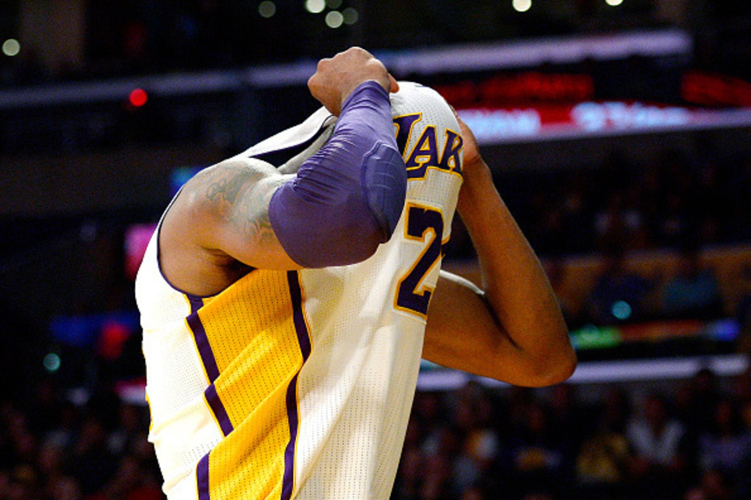 LOS ANGELES, CA - NOVEMBER 29: Kobe Bryant #24 of the Los Angeles Lakers hides his face inside his jersey after throwing an errand pass to a teammate during the second half of the basketball game against Indiana Pacers at Staples Center November 29, 2015,