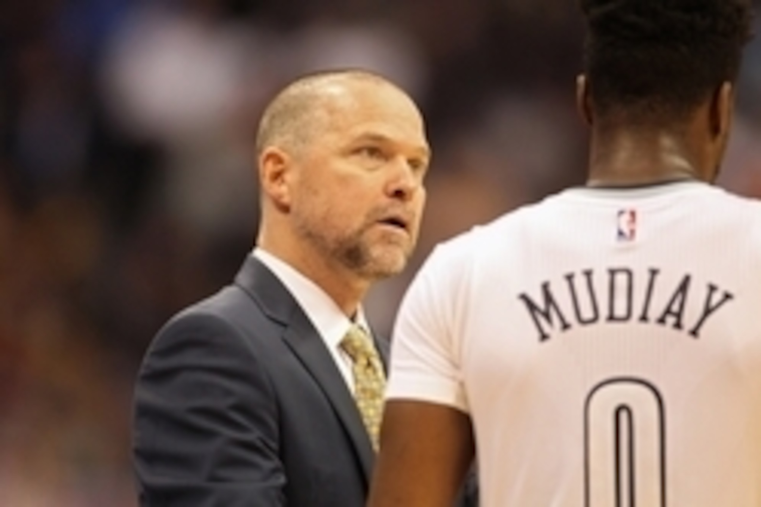 Nov 22, 2015; Denver, CO, USA; Denver Nuggets head coach Michael Malone talks with guard Emmanuel Mudiay (0) during the second half against the Golden State Warriors at Pepsi Center. The Warriors won 118-105. Mandatory Credit: Chris Humphreys-USA TODAY Sp