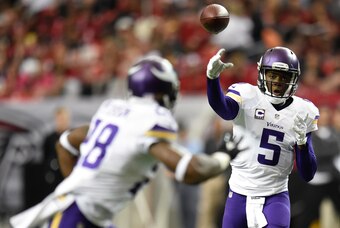 Nov 29, 2015; Atlanta, GA, USA; Minnesota Vikings quarterback Teddy Bridgewater (5) passes to running back Adrian Peterson (28) against the Atlanta Falcons during the first quarter at the Georgia Dome. Mandatory Credit: Dale Zanine-USA TODAY Sports