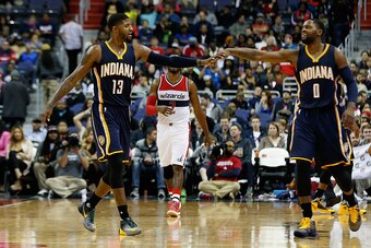 WASHINGTON, DC - NOVEMBER 24: Paul George #13 and C.J. Miles #0 of the Indiana Pacers celebrate during the closing minute of the Pacers 123-106 win over the Washington Wizards at Verizon Center on November 24, 2015 in Washington, DC. NOTE TO USER: User ex