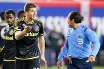 Nov 29, 2015; Harrison, NJ, USA; Columbus Crew defender Columbus Crew defender Gaston Sauro (22)  argues with referee Baldomero Toledo during the second half of leg two of the Eastern Conference championship at Red Bull Arena. The Crew defeated the Red Bu