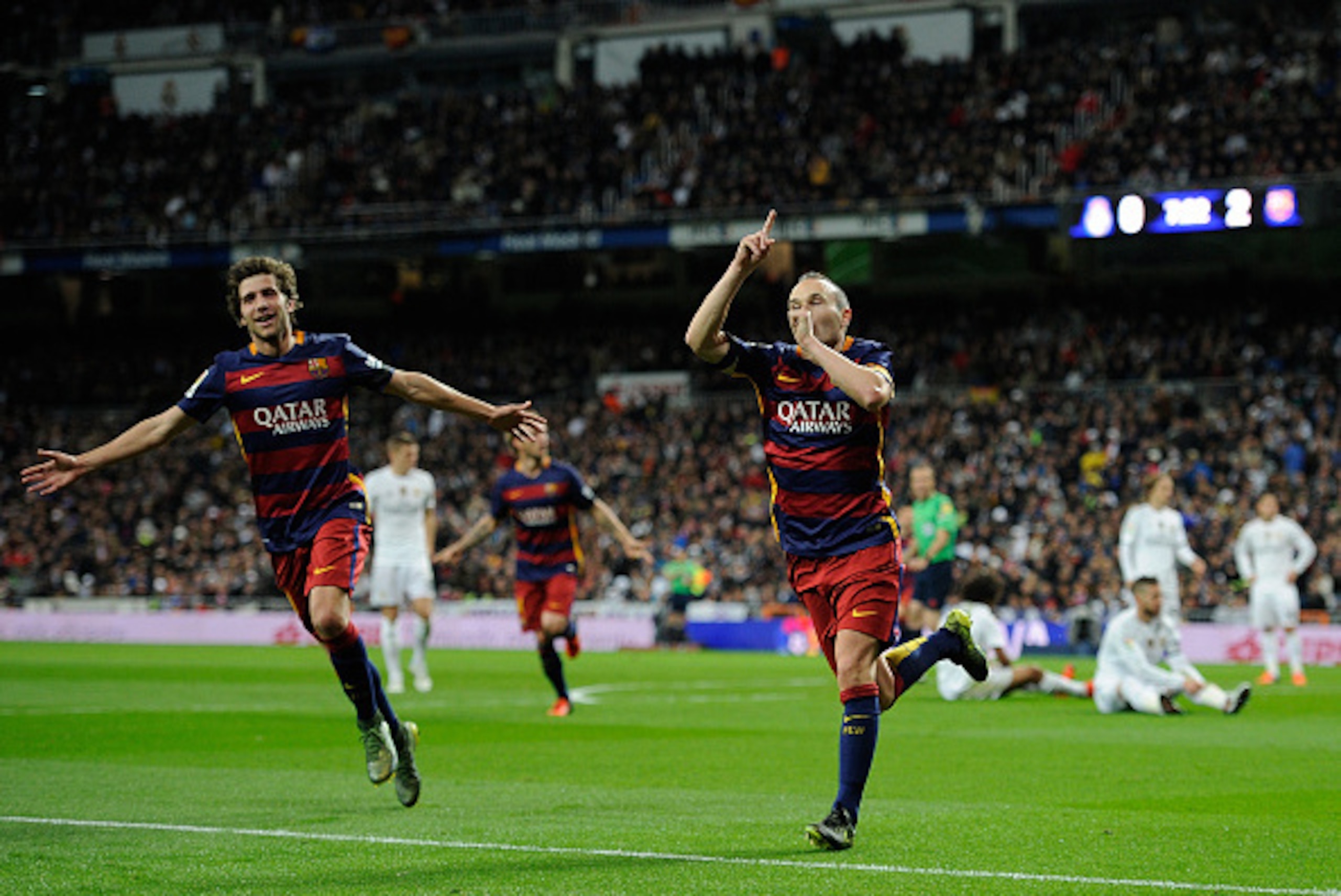 MADRID, SPAIN - NOVEMBER 21:  Andres Iniesta of FC Barcelona celebrates with Sergi Roberto after scoring his team's 3rd goal during the La Liga match between Real Madrid and Barcelona at Estadio Santiago Bernabeu on November 21, 2015 in Madrid, Spain.  (P