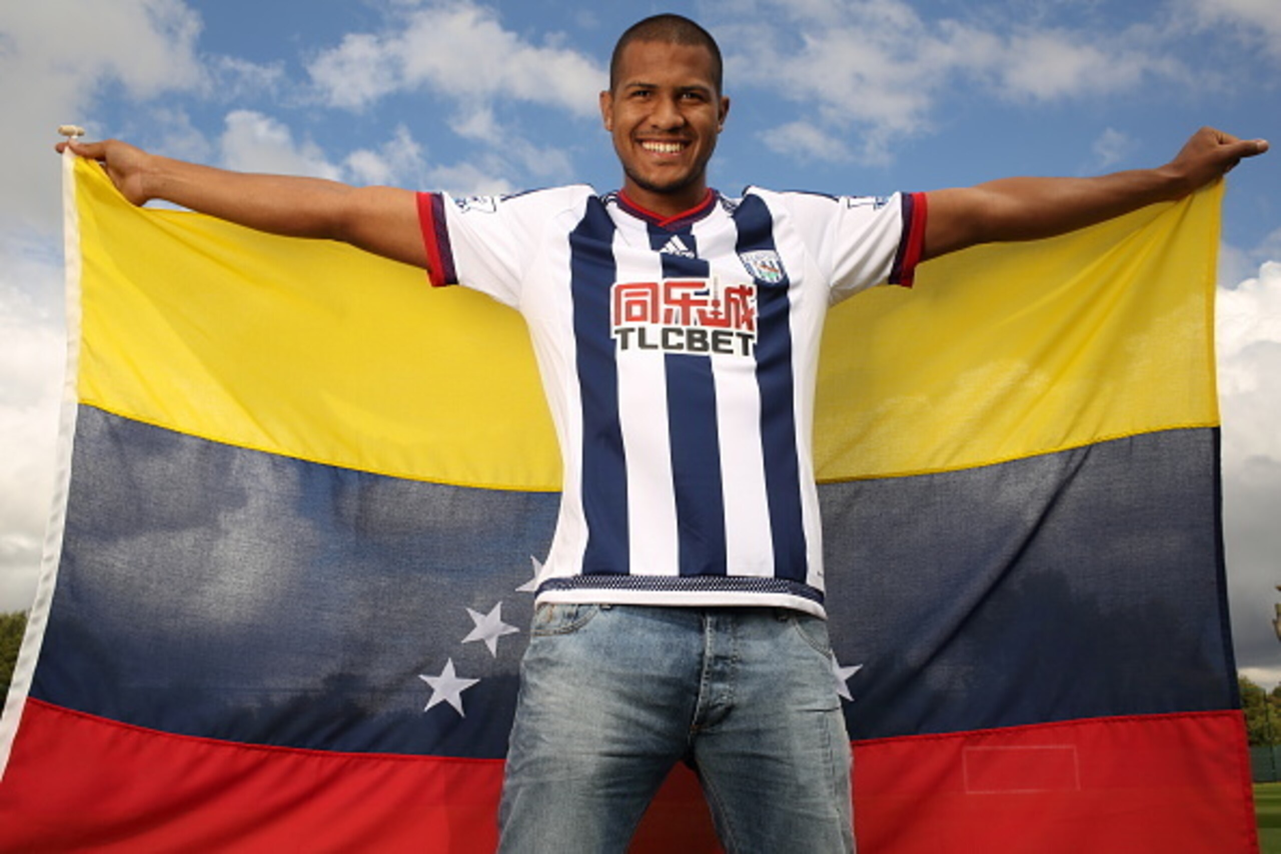 WEST BROMWICH, ENGLAND - AUGUST 06:  In this image released on August 10, 2015, Jose Salomon Rondon poses with the flag of Venezuela as he is unveiled by West Bromwich Albion at West Bromwich Albion Training Ground on August 6, 2015 in West Bromwich, Engl