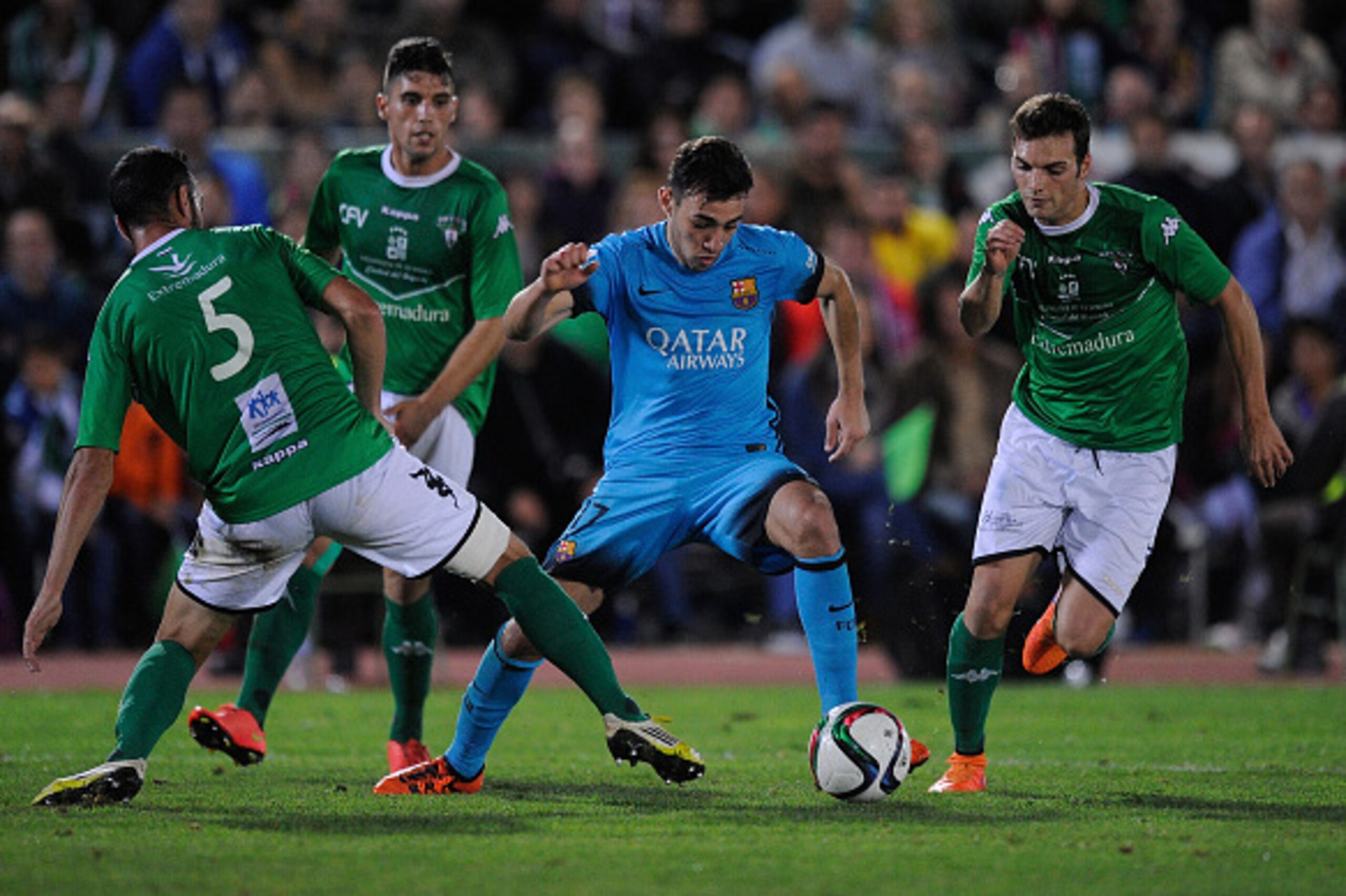 VILLANUEVA DE LA SERENA, SPAIN - OCTOBER 28:  Munir el Haddadi of FC Barcelona gets past Javi Sanchez of C.F. Villanovense during of the Copa del Rey Last of 16 First Leg match between C.F. Villanovense and F.C. Barcelona at estadio Romero Cuerda on Octob