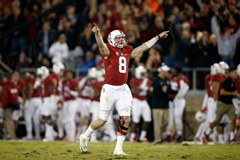 PALO ALTO, CA - NOVEMBER 21:  Kevin Hogan #8 of the Stanford Cardinal celebrates after he threw a touchdown pass to Christian McCaffrey #5 during their game against the California Golden Bears at Stanford Stadium on November 21, 2015 in Palo Alto, Califor