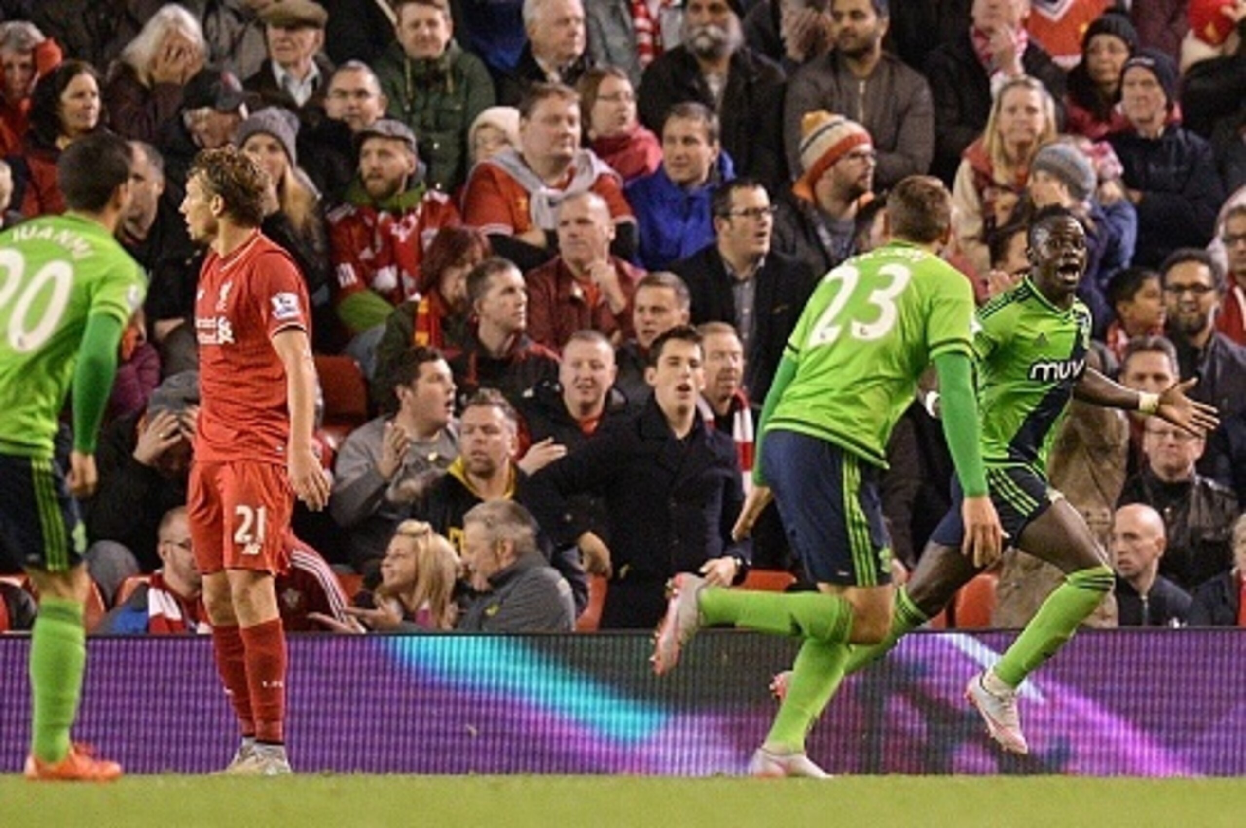 Southampton's Senegalese midfielder Sadio Mane (R) celebrates with teammates after he scores their first goal during the English Premier League football match between Liverpool and Southampton at Anfield stadium in Liverpool, north west England on October