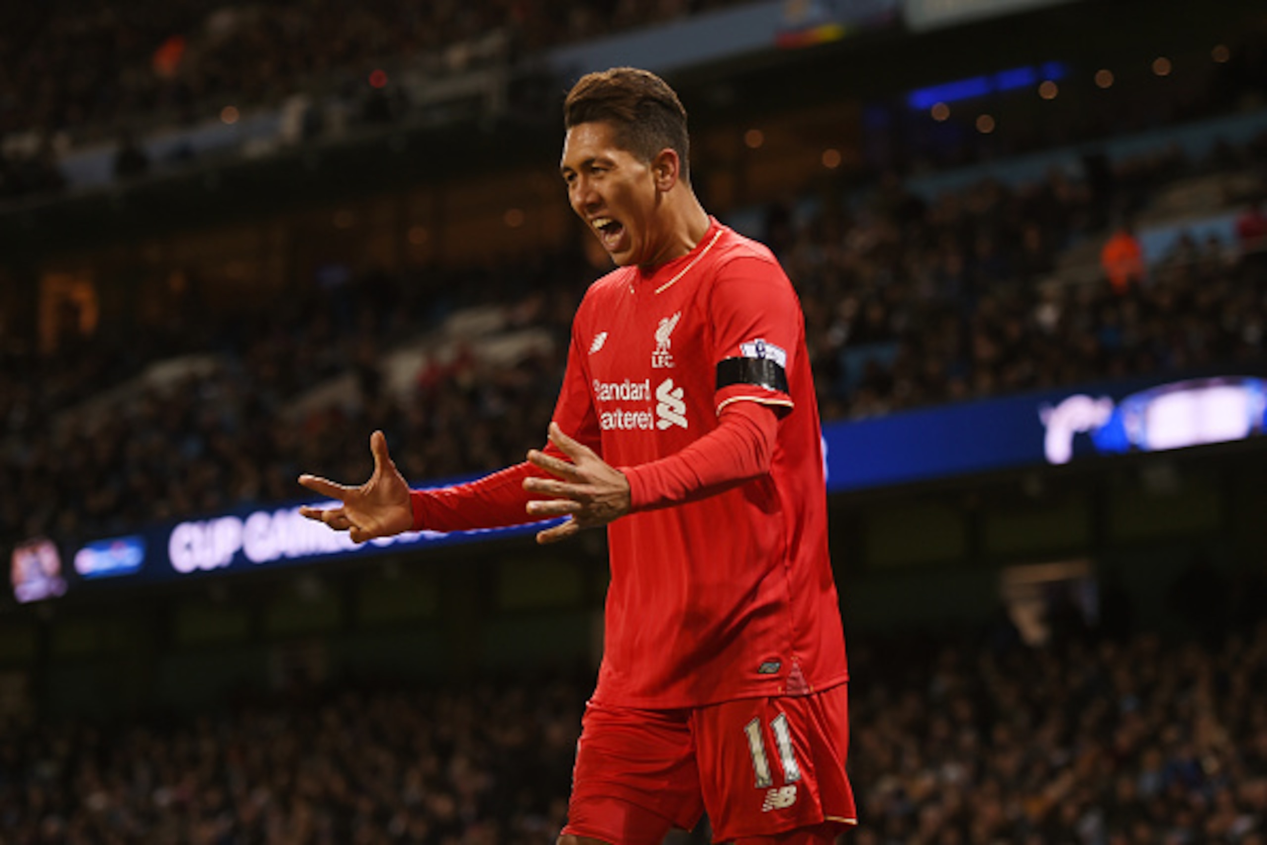 MANCHESTER, ENGLAND - NOVEMBER 21:  Roberto Firmino of Liverpool celebrates his team's first goal scored by Eliaquim Mangala of Manchester City during the Barclays Premier League match between Manchester City and Liverpool at Etihad Stadium on November 21